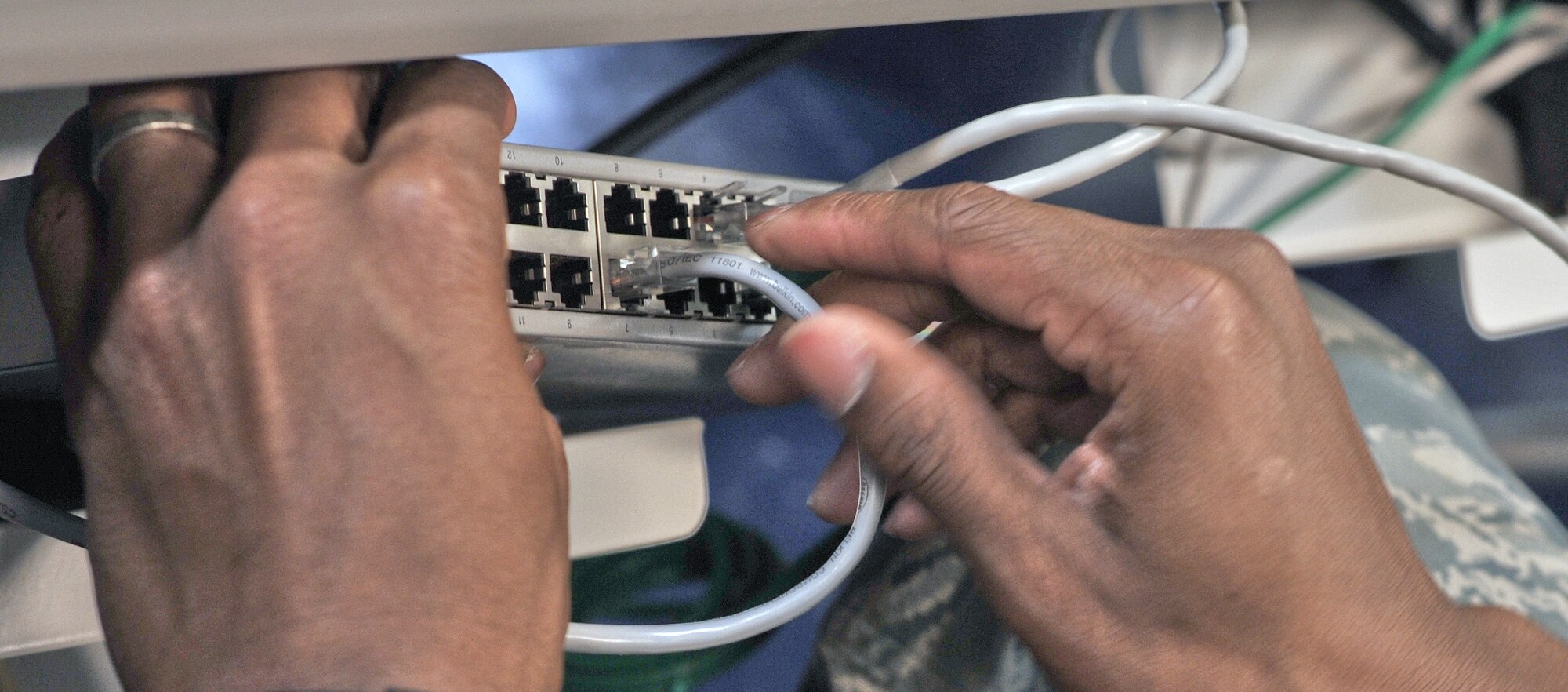 ANDERSEN AFB, Guam—Airmen from the 644th Combat Communication Squadron set up a computer lab in the elementary school here Sept. 9. Volunteers from the 644 CBCS visited the Andersen Elementary School to setup a new computer lab and Smart Boards for students. (U.S. Air Force photo by Staff Sgt. Alexandre Montes)