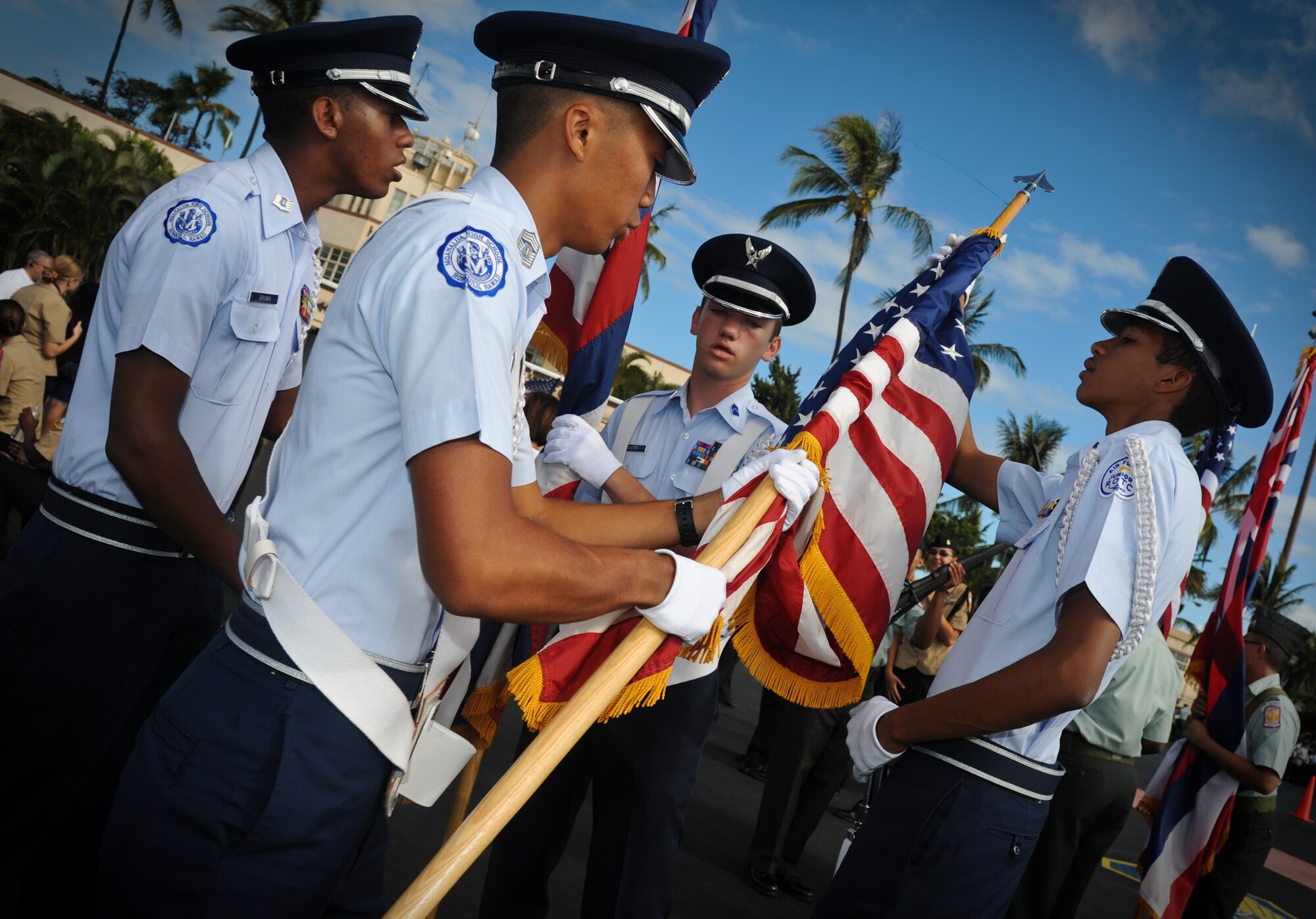 Junior Reserve Officer's Training Corps cadets from Moanalua High School adjust their flag as they prepare to compete at the annual drill competition held on the Hickam Field flightline, Sept. 10. More than 300 JROTC cadets, from more than 14 high schools on Oahu attended the event. (U.S. Air Force photo/Senior Airman Lauren Main)