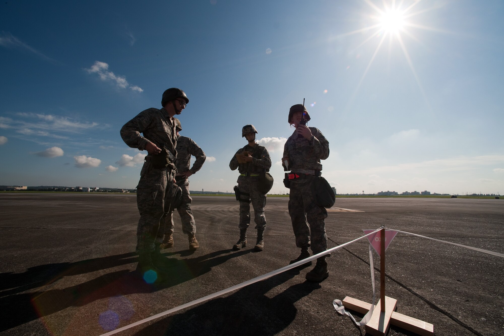 YOKOTA AIR BASE, Japan -- The 374th Maintenance Squadron post attack reconnaissance team reports to the Unit Control Center after setting up an exploded ordnance cordon at Yokota Air Base, Japan, Sept. 13, 2011 during a wing readiness exercise. (U.S. Air Force photo/Osakabe Yasuo