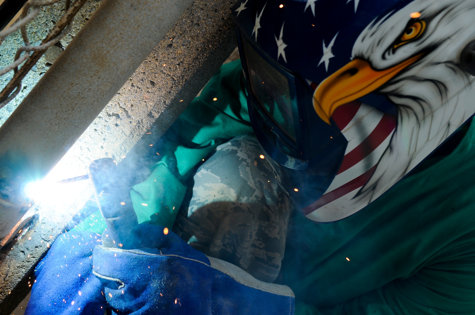Staff Sgt. Dino Parrella, 18th Civil Engineer Squadron metal shop structural journeyman, welds together a gate at the Four Diamonds softball field on Kadena Air Base, Japan, Sept. 7. Whether they're welding together a fence at the base softball fields or protecting multi-million-dollar Air Force assets, this organization keeps the base's rough edges smoothed down. (U.S. Air Force photo/ Airman 1st Class Maeson L. Elleman)