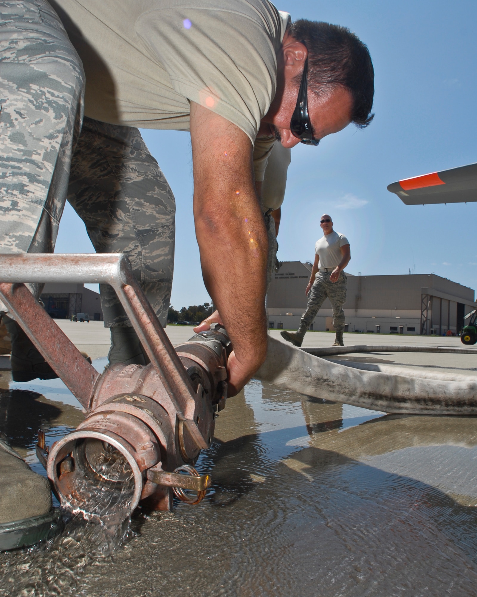 Members from the 146th Airlift Wing prepare a C130J loaded with MAFFS (Modular Airborn Fire Fighting System) with water for a test before leaving the Channel Islands Air National Guard Station, Port Hueneme, Calif., on September 11, 2011. The 146th Airlift Wing is assisting with ongoing fiefighting efforts in Kern County Calif. (U.S. Air Force photo by SrA Nicholas Carzis)