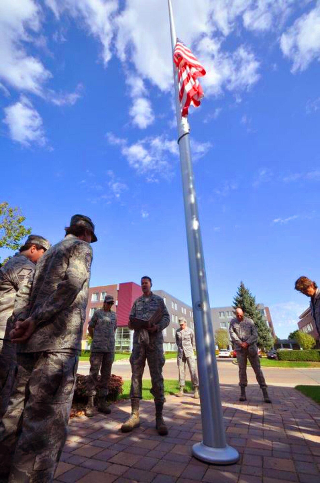 Members of the 934th Airlift Wing, Minneapolis ARS Minnesota, take a moment to reflect on the events of September 11th 2001. A small remembrance ceremony was held outside the headquarters building Sunday morning. Minneapolis ARS MN. (Air Force Photo/TSgt Bob Sommer)