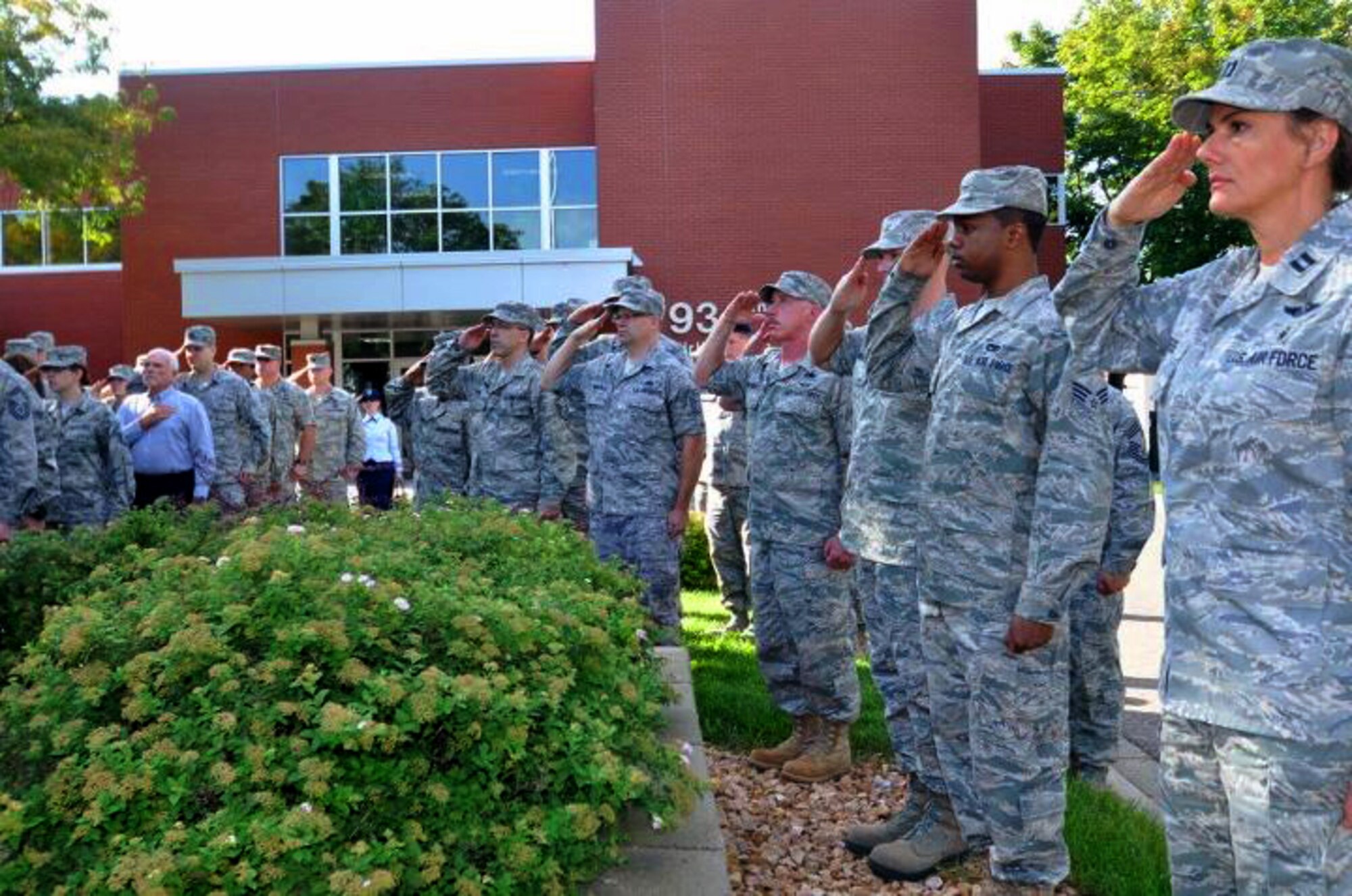 Members of the 934th Airlift Wing, Minneapolis ARS Minnesota, take a moment to reflect on the events of September 11th 2001. A small remembrance ceremony was held outside the headquarters building Sunday morning. Minneapolis ARS MN. (Air Force Photo/TSgt Bob Sommer)