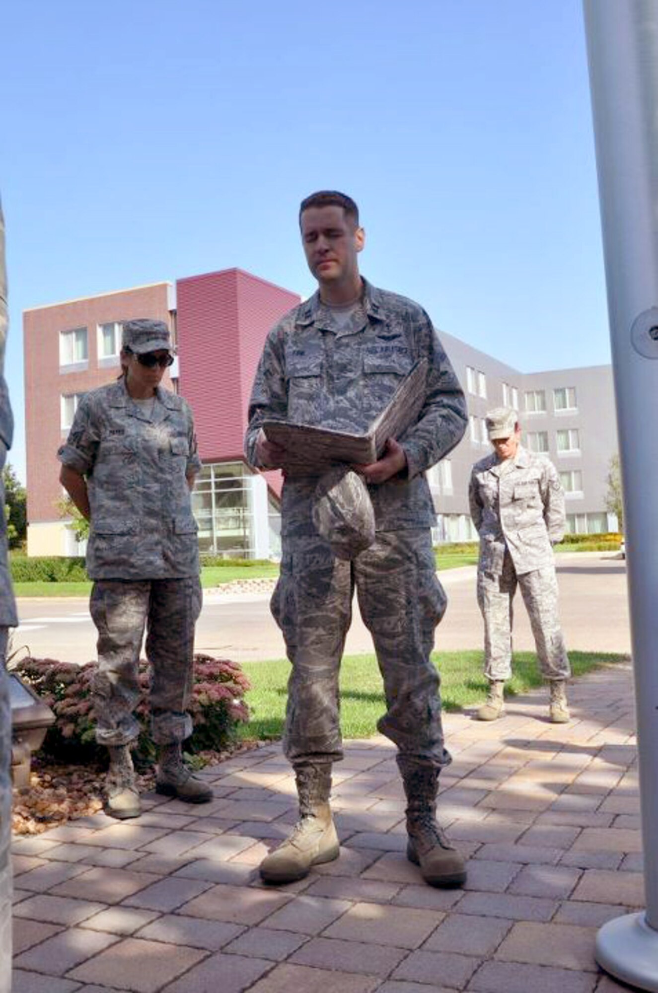 Members of the 934th Airlift Wing, Minneapolis ARS Minnesota, take a moment to reflect on the events of September 11th 2001. A small remembrance ceremony was held outside the headquarters building Sunday morning. Minneapolis ARS MN. (Air Force Photo/TSgt Bob Sommer)