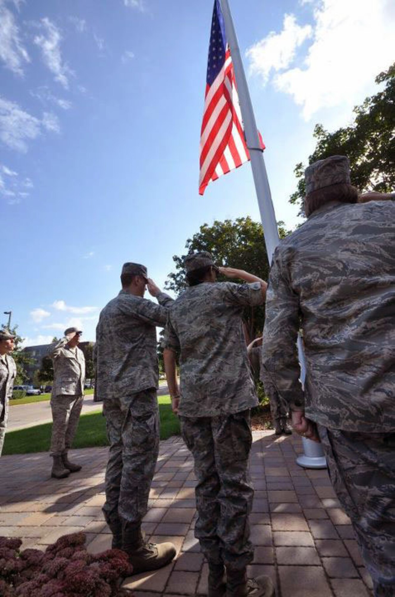 Members of the 934th Airlift Wing, Minneapolis ARS Minnesota, take a moment to reflect on the events of September 11th 2001. A small remembrance ceremony was held outside the headquarters building Sunday morning. Minneapolis ARS MN. (Air Force Photo/TSgt Bob Sommer)