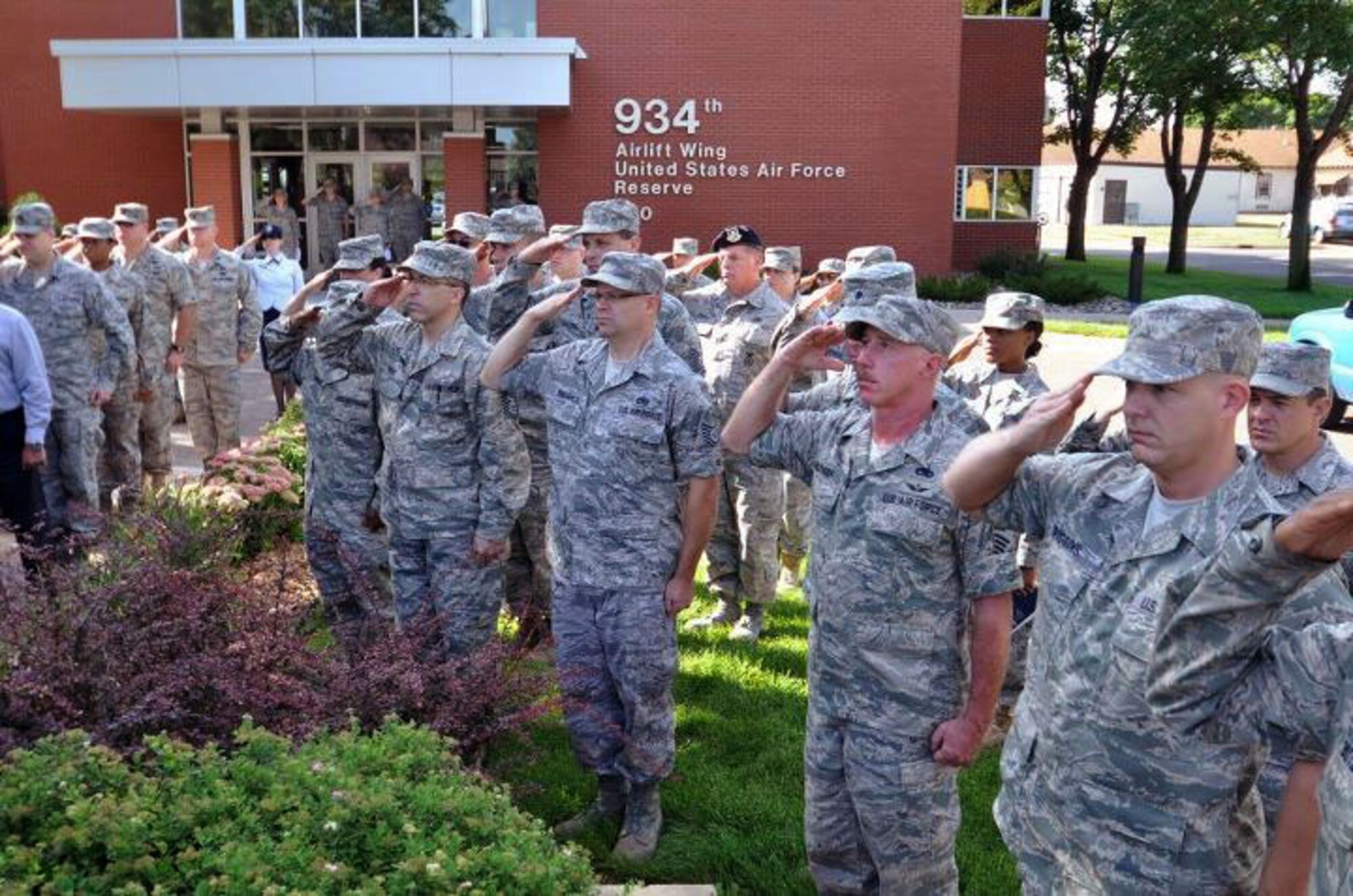Members of the 934th Airlift Wing, Minneapolis ARS Minnesota, take a moment to reflect on the events of September 11th 2001. A small remembrance ceremony was held outside the headquarters building Sunday morning. Minneapolis ARS MN. (Air Force Photo/TSgt Bob Sommer)