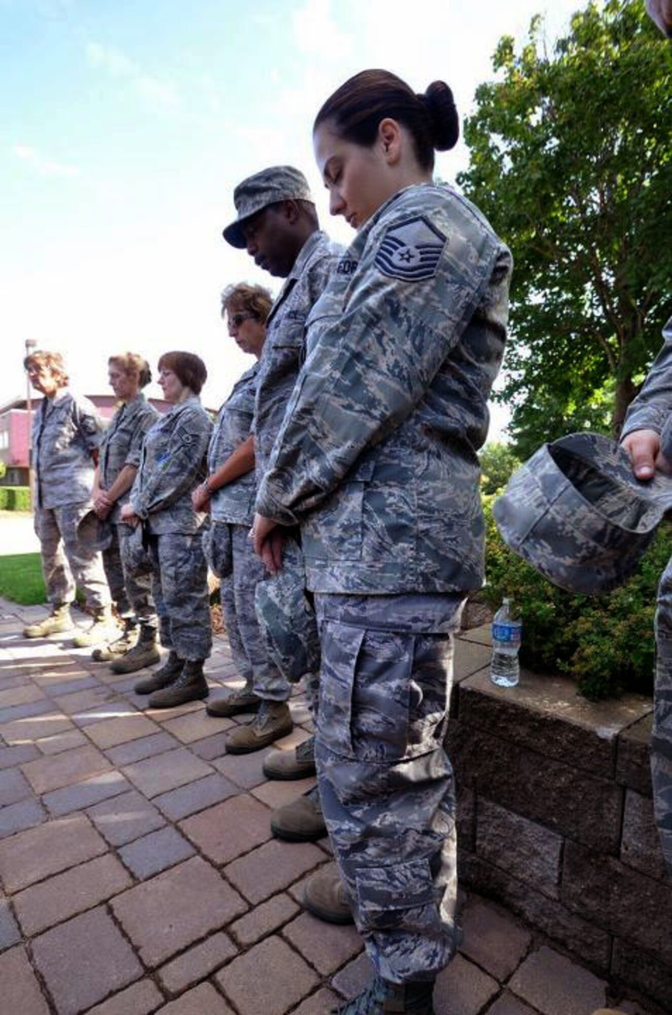 Members of the 934th Airlift Wing, Minneapolis ARS Minnesota, take a moment to reflect on the events of September 11th 2001. A small remembrance ceremony was held outside the headquarters building Sunday morning. Minneapolis ARS MN. (Air Force Photo/TSgt Bob Sommer)