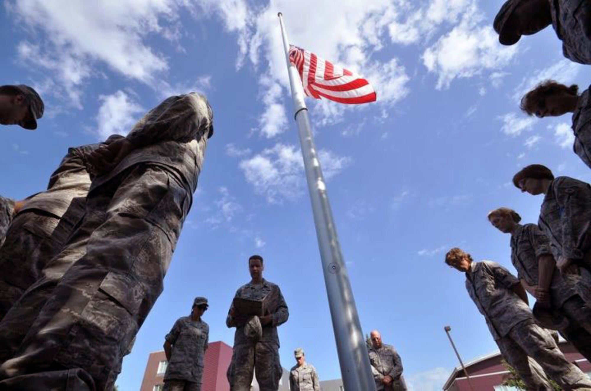 Members of the 934th Airlift Wing, Minneapolis ARS Minnesota, take a moment to reflect on the events of September 11th 2001. A small remembrance ceremony was held outside the headquarters building Sunday morning. Minneapolis ARS MN. (Air Force Photo/TSgt Bob Sommer)