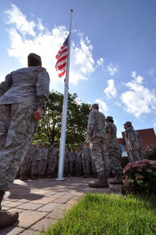 Members of the 934th Airlift Wing, Minneapolis ARS Minnesota, take a moment to reflect on the events of September 11th 2001. A small remembrance ceremony was held outside the headquarters building Sunday morning. Minneapolis ARS MN. (Air Force Photo/TSgt Bob Sommer)