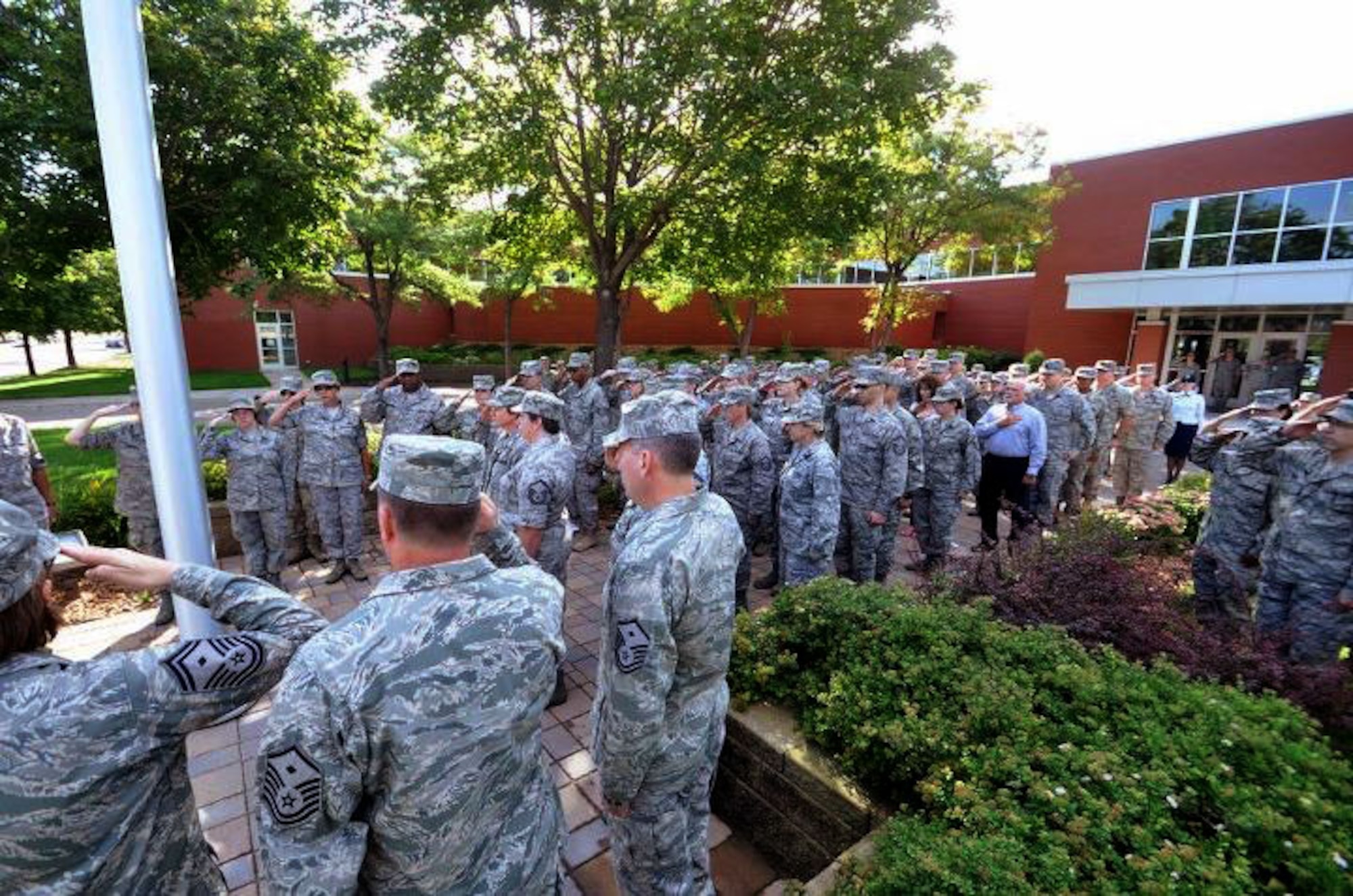 Members of the 934th Airlift Wing, Minneapolis ARS Minnesota, take a moment to reflect on the events of September 11th 2001. A small remembrance ceremony was held outside the headquarters building Sunday morning. Minneapolis ARS MN. (Air Force Photo/TSgt Bob Sommer)