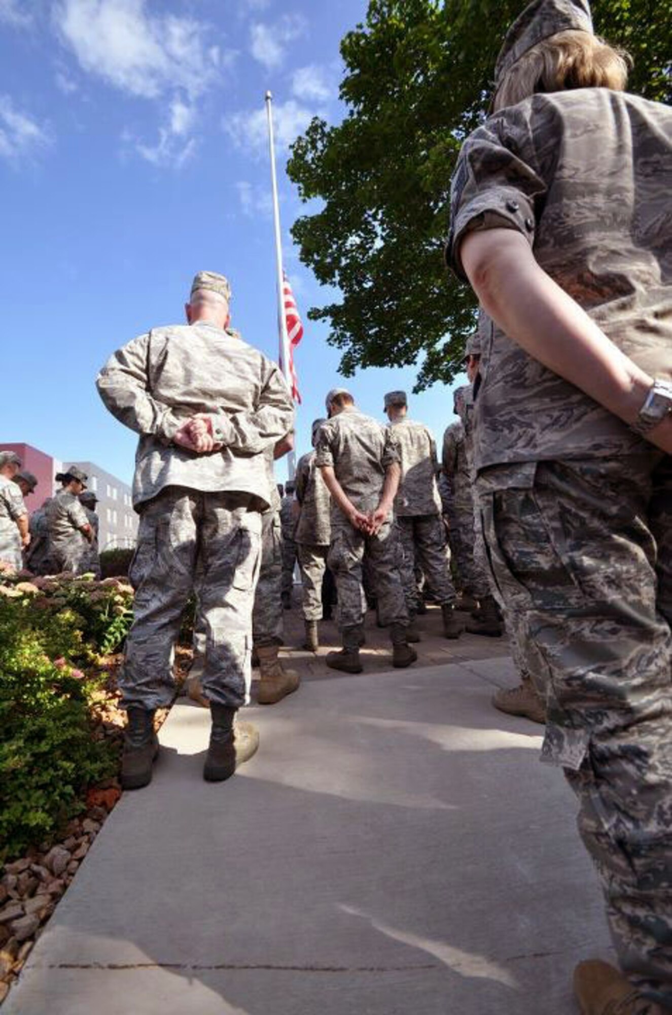 Members of the 934th Airlift Wing, Minneapolis ARS Minnesota, take a moment to reflect on the events of September 11th 2001. A small remembrance ceremony was held outside the headquarters building Sunday morning. Minneapolis ARS MN. (Air Force Photo/TSgt Bob Sommer)