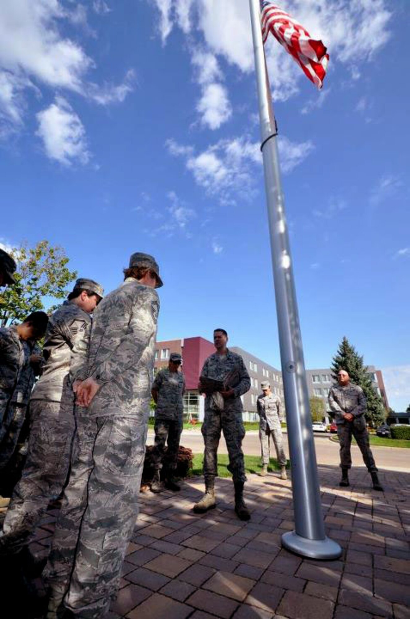 Members of the 934th Airlift Wing, Minneapolis ARS Minnesota, take a moment to reflect on the events of September 11th 2001. A small remembrance ceremony was held outside the headquarters building Sunday morning. Minneapolis ARS MN. (Air Force Photo/TSgt Bob Sommer)