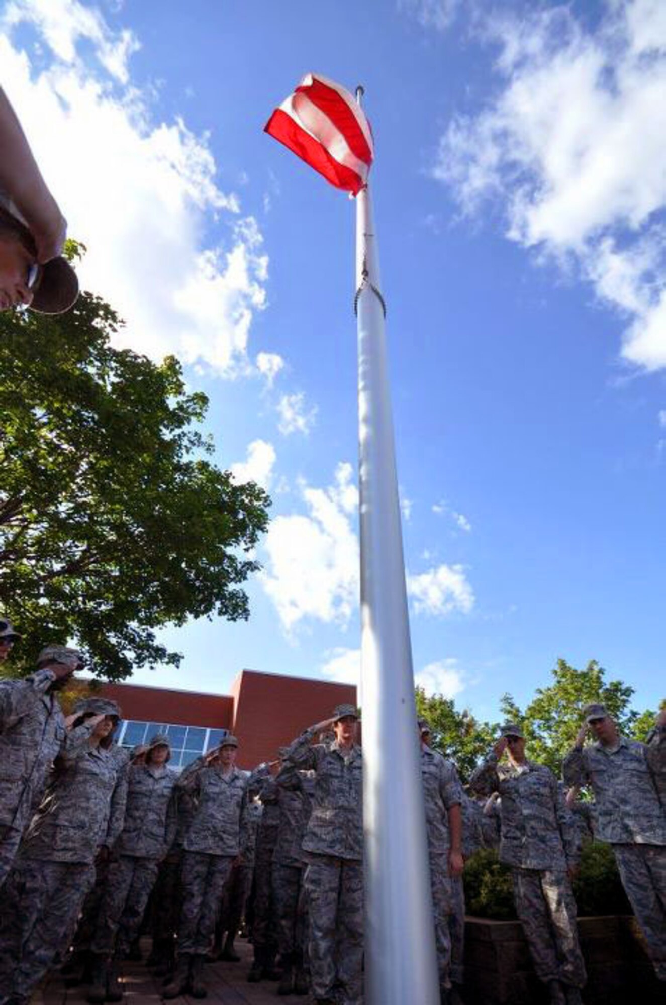 Members of the 934th Airlift Wing, Minneapolis ARS Minnesota, take a moment to reflect on the events of September 11th 2001. A small remembrance ceremony was held outside the headquarters building Sunday morning. Minneapolis ARS MN. (Air Force Photo/TSgt Bob Sommer)
