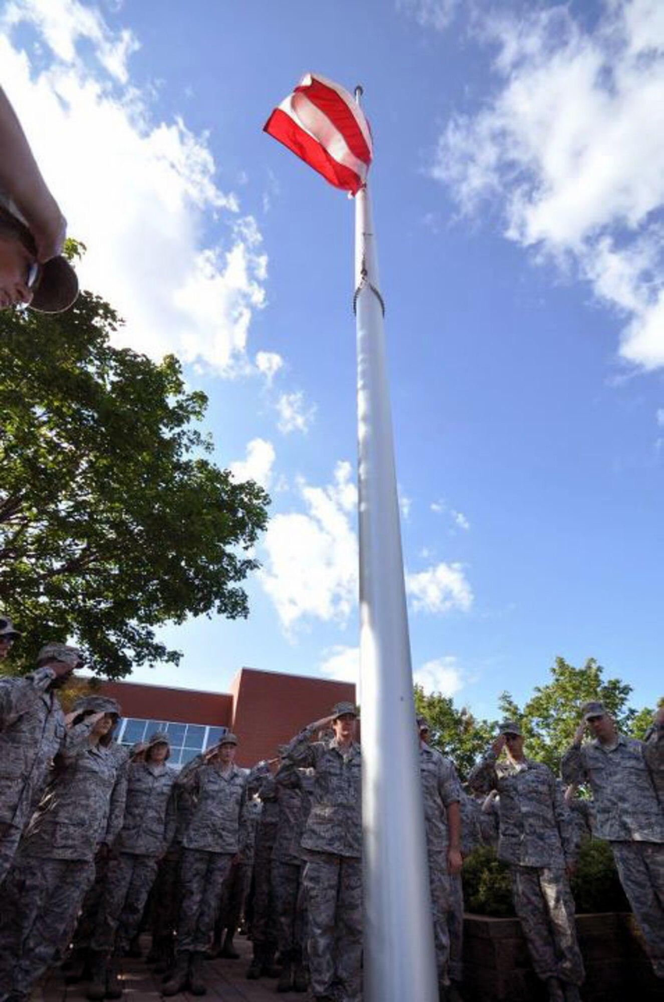 Members of the 934th Airlift Wing, Minneapolis ARS Minnesota, take a moment to reflect on the events of September 11th 2001. A small remembrance ceremony was held outside the headquarters building Sunday morning. Minneapolis ARS MN. (Air Force Photo/TSgt Bob Sommer)