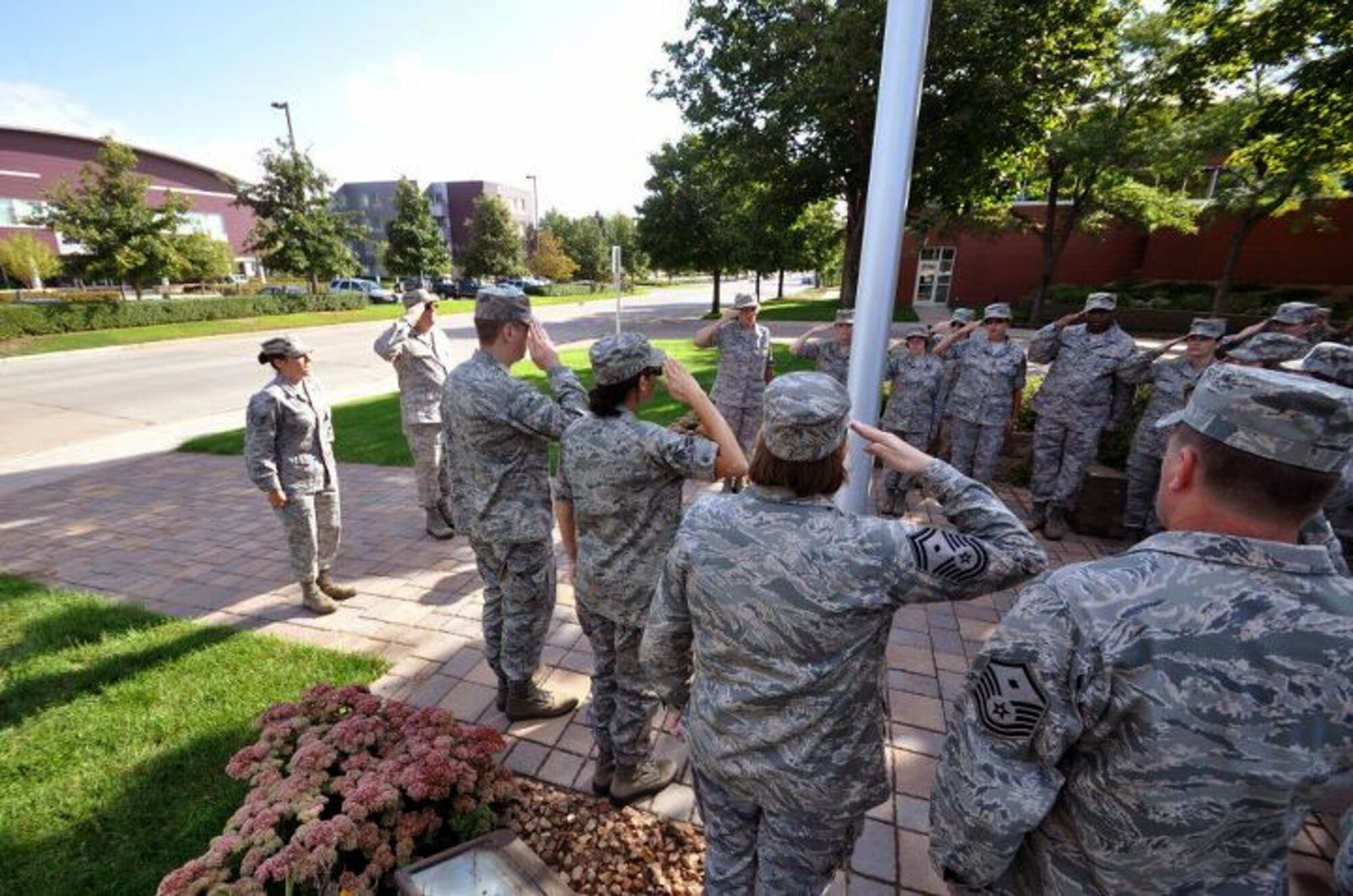 Members of the 934th Airlift Wing, Minneapolis ARS Minnesota, take a moment to reflect on the events of September 11th 2001. A small remembrance ceremony was held outside the headquarters building Sunday morning. Minneapolis ARS MN. (Air Force Photo/TSgt Bob Sommer)