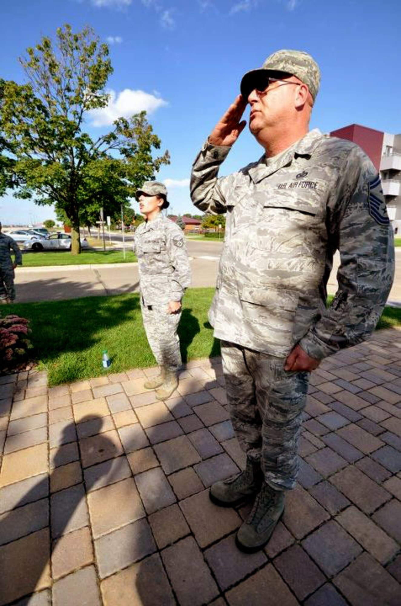 Members of the 934th Airlift Wing, Minneapolis ARS Minnesota, take a moment to reflect on the events of September 11th 2001. A small remembrance ceremony was held outside the headquarters building Sunday morning. Minneapolis ARS MN. (Air Force Photo/TSgt Bob Sommer)