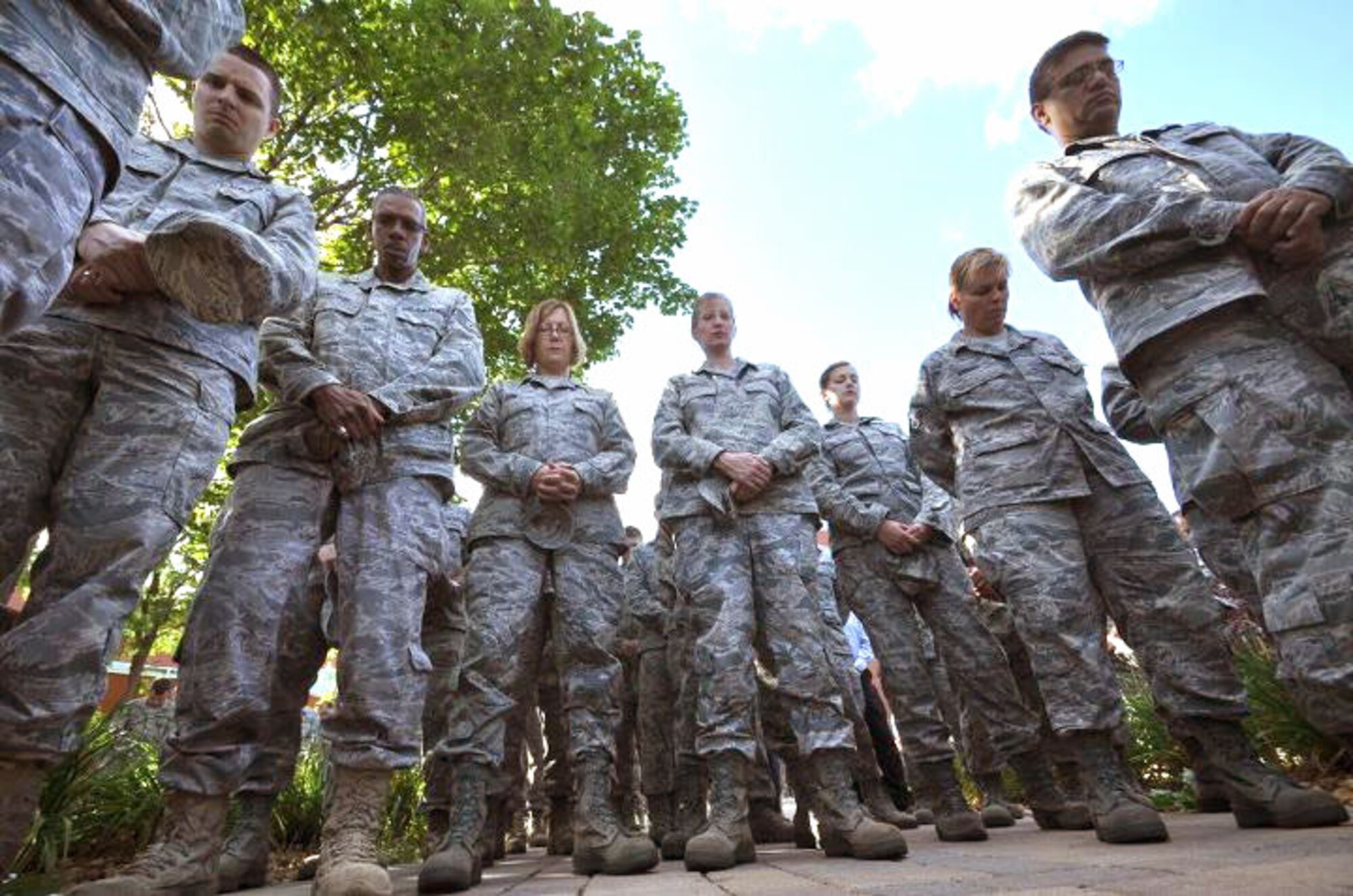 Members of the 934th Airlift Wing, Minneapolis ARS Minnesota, take a moment to reflect on the events of September 11th 2001. A small remembrance ceremony was held outside the headquarters building Sunday morning. Minneapolis ARS MN. (Air Force Photo/TSgt Bob Sommer)