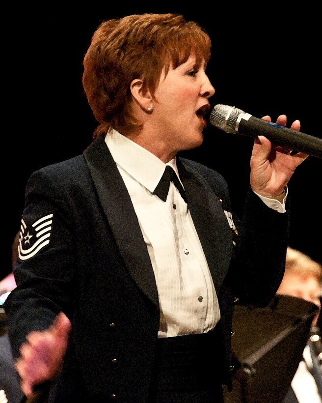 TSgt Erin McPherson of the Air national Guard Band of the Southwest performs Celine Dion's arragement of "God Bless America" for the audience in Oxnard California. Arrangment was scored by AIC Jose Fausto. July 10, 2010

Photo by Msgt Dave Buttner