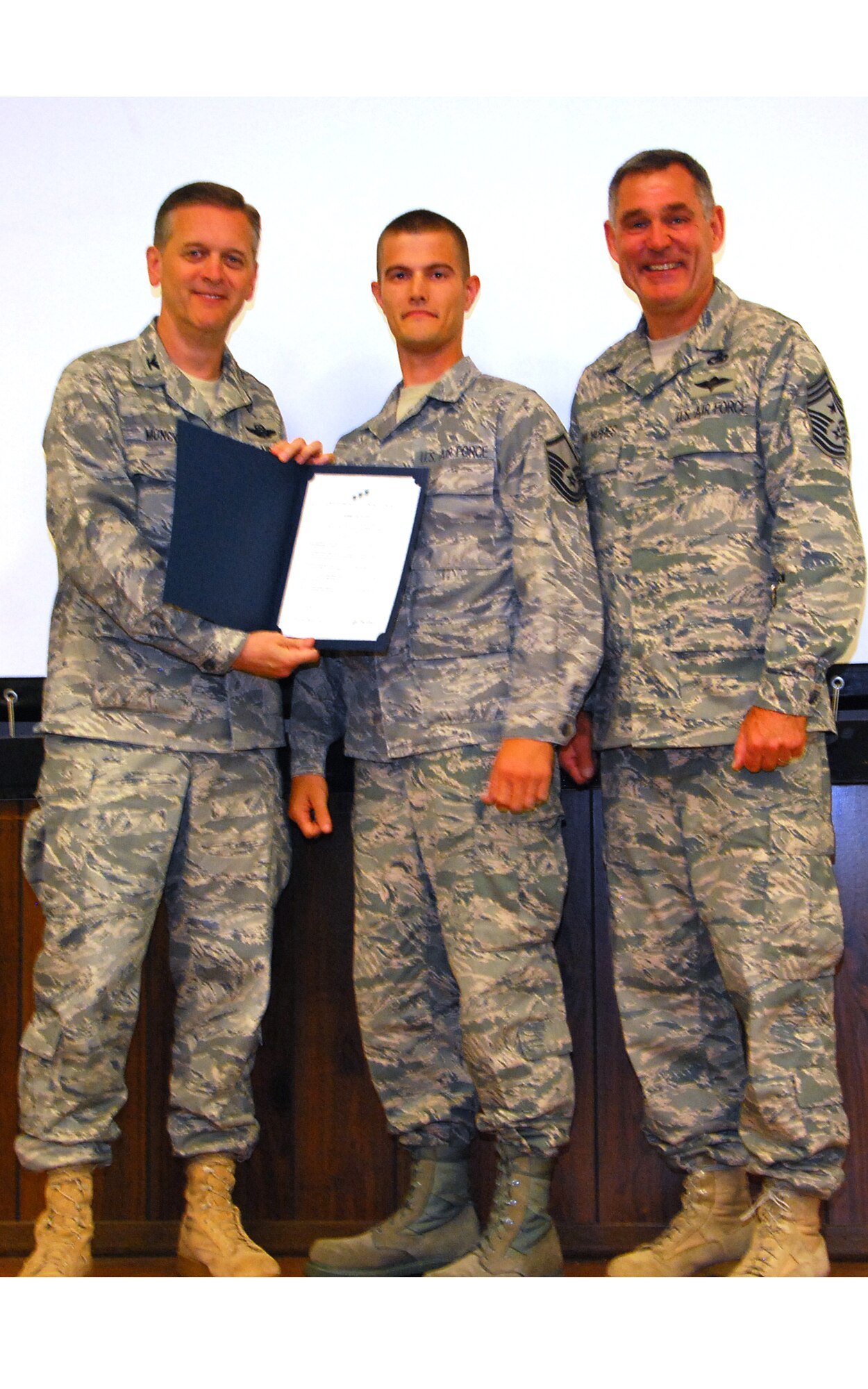 JOINT BASE ANDREWS, Md. -- The 459th Air Refueling Wing held its second Non-comissioned officer and Senior Non-commissioned officer induction ceremony of 2011 in the Wing Auditorium here, Sept. 11, 2011. The induction ceremonies are sponsored by the wing's Top 3 organization and will be held at multiple times throughout the year for Airmen who have made the NCO and SNCO ranks. (U.S. Air Force photo/SrA Amber Russell)