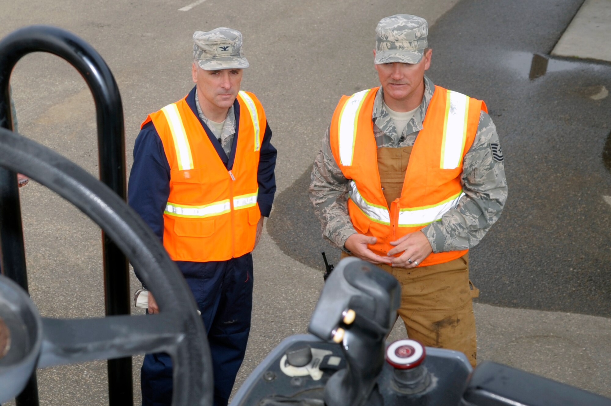 VANDENBERG AIR FORCE BASE, Calif. -- Col. Richard Boltz, 30th Space Wing commander, receives a briefing about an asphalt roller at the 30th Civil Engineer Squadron compound parking lot here Wednesday, Aug. 24, 2011. (U.S. Air Force photo/Jerry E. Clemens, Jr.)