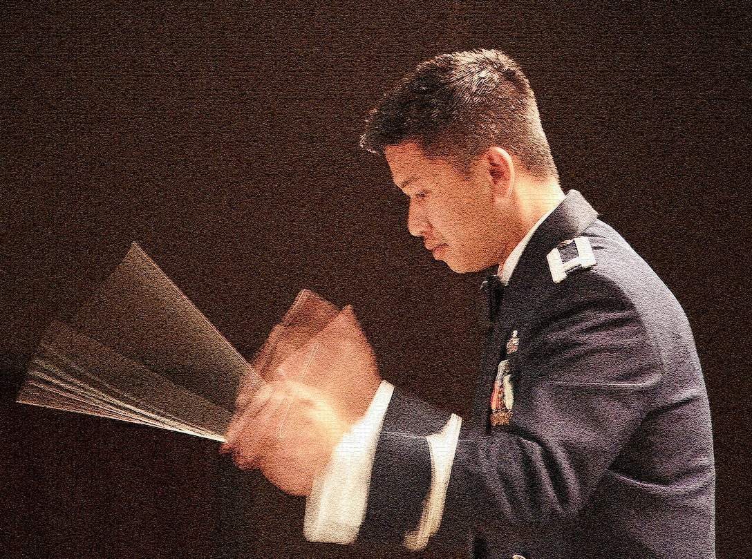 Captain Vu Nguyen, Commander of the 561st Air Force Band, conducts the combined Air National Guard Bands of California during a concert in Oxnard California. July 10,2010

Photo by MSgt Dave Buttner