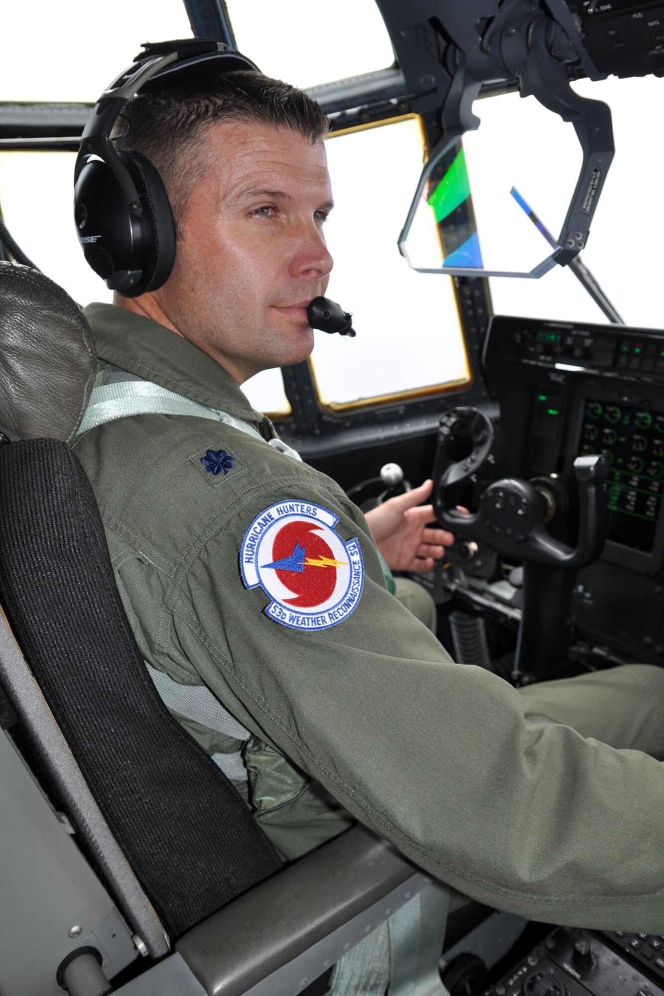 Lt. Col. Sean Pierce, 53rd Weather Reconnaissance Squadron director of operations, looks out the right side of the aircraft to check the weather conditions from Tropical Storm Nate Sept. 7. The Hurricane Hunters were flying a low-level invest to gather information about the storm for the National Hurricane Center. (U.S. Air Force photo by Staff Sgt. Valerie Smock)