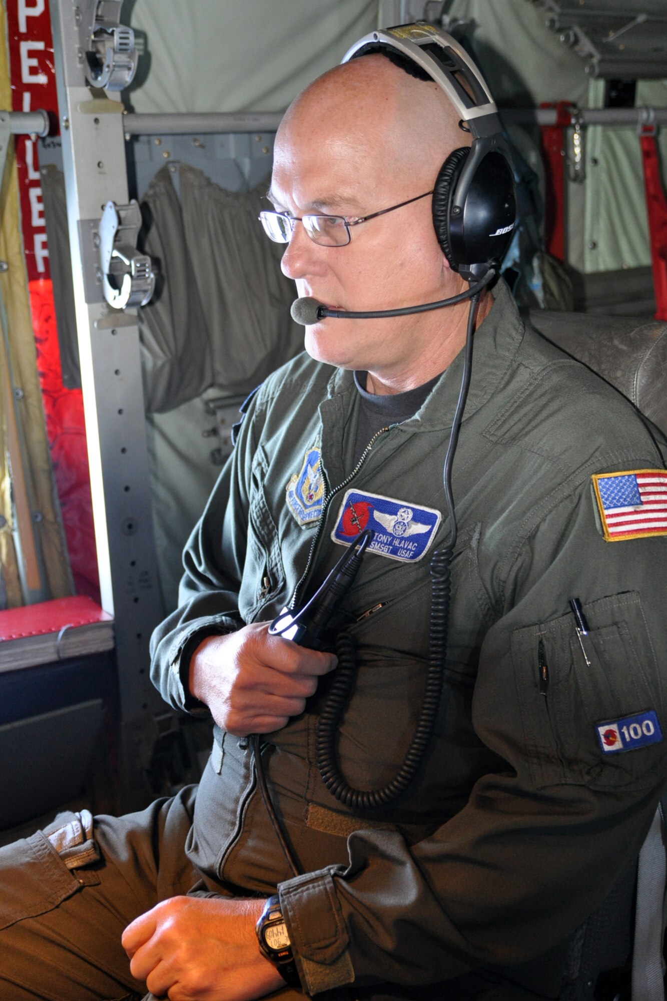 Senior Master Sgt. Tony Hlavac, a weather reconnaissance loadmaster with the 53rd Weather Reconnaissance Squadron, communicates with the other members of the aircrew as they fly into Tropical Storm Nate Sept. 7. The loadmaster also collects and records vertical meteorological data using a dropsonde. (U.S. Air Force photo by Staff Sgt. Valerie Smock)