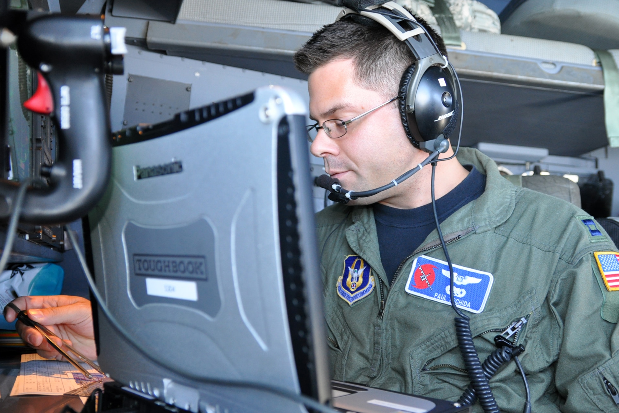 Capt. Paul Tschida, a navigator with the 53rd Weather Reconnaissance Squadron, keeps track of the aircraft's position and movement while flying Tropical Storm Nate Sept. 7. The navigator also monitors the radar to avoid tornadic activity. (U.S. Air Force photo by Staff Sgt. Valerie Smock)