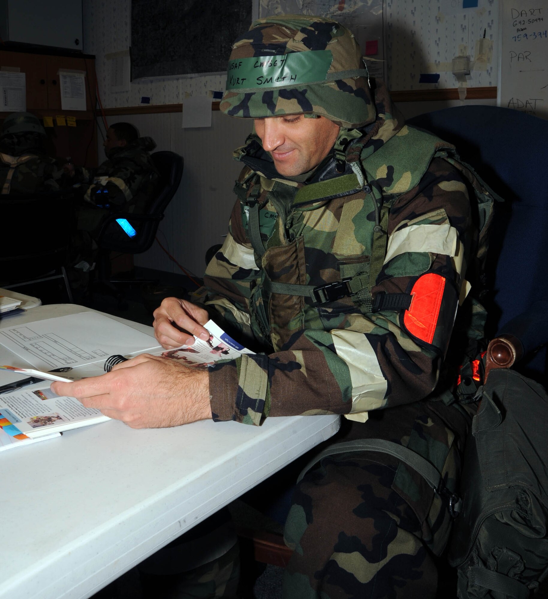 Chief Master Sgt. Kurt Smith, 931st Civil Engineer Squadron, studies his Airman's Manual during an operational readiness excercise at McConnell Air Force Base, Kan., Sept. 11, 2011.  The excercise was conducted to prepare the unit for an upcoming operational readiness inspection. (U.S. Air Force photo by 1st Lt. Zach Anderson)