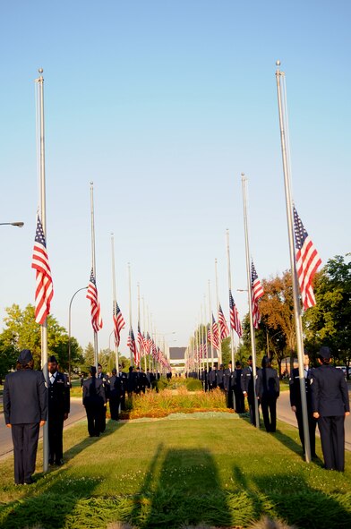 More than 100 Airmen raise American flags to half mast at the 9/11 Remembrance Ceremony on Grand Forks Air Force Base Sept 11. The ceremony marked the 10 year anniversary of the terrorist attacks in New York, Pennsylvania and Washington D.C. (U.S Air Force photo by Senior Airman Amanda N. Stencil)