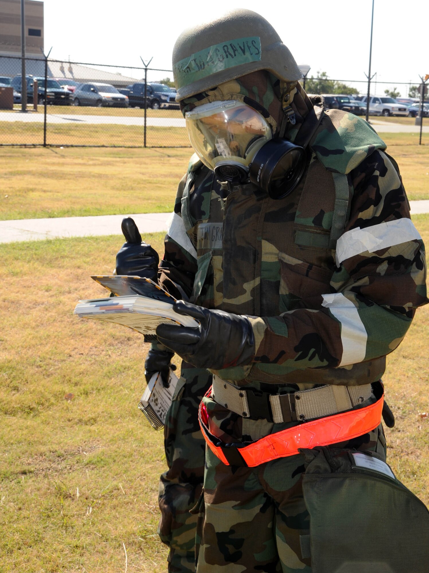 Senior Airman Jon Graves, 931st Civil Engineer Squadron, checks his Airman's Manual while participating in a post-attack reconnaissance sweep during an operational readiness excercise at McConnell Air Force Base, Kan., Sept. 11, 2011.  The excercise was conducted to prepare the unit for an upcoming operational readiness inspection. (U.S. Air Force photo by 1st Lt. Zach Anderson)