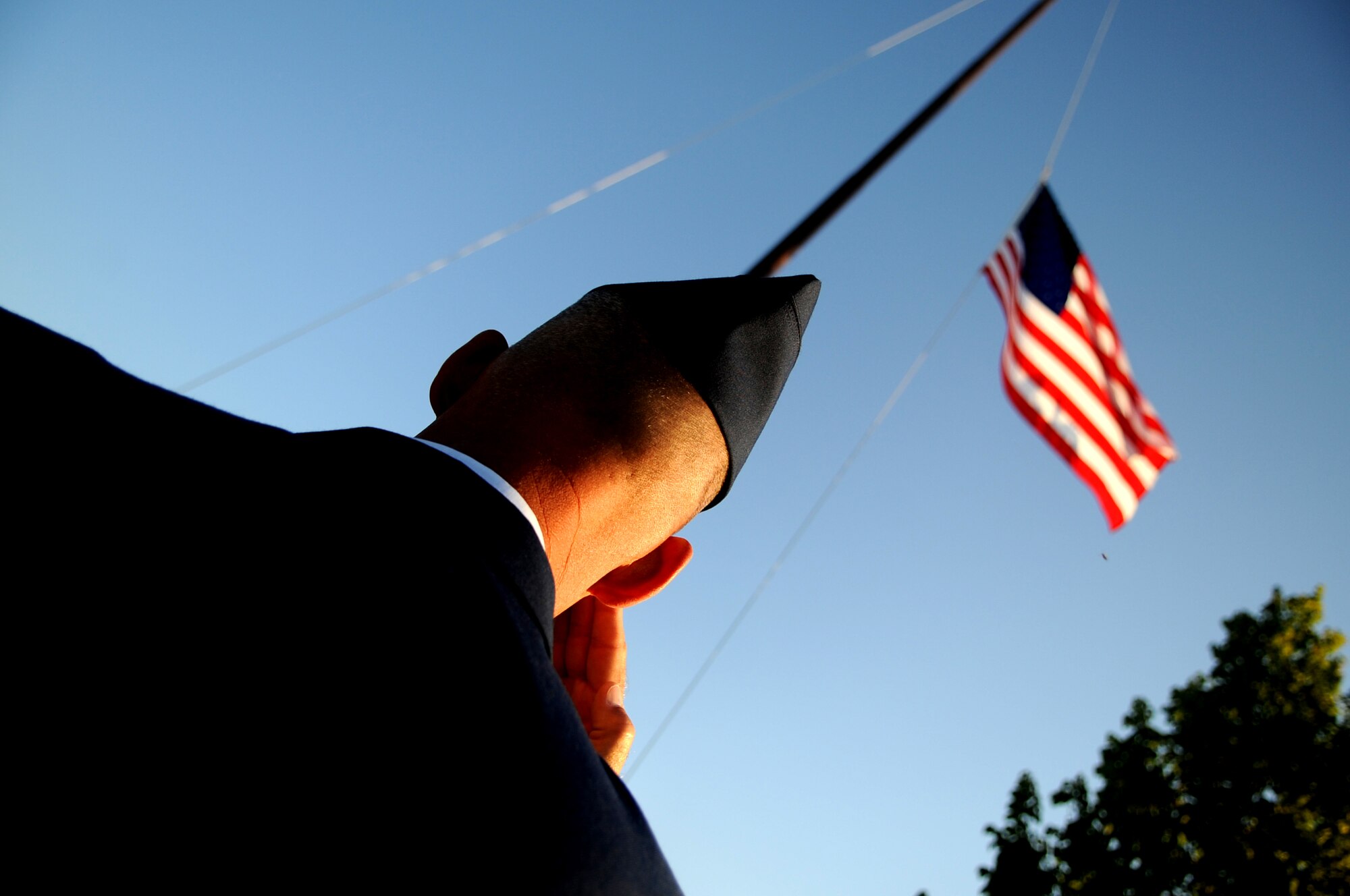 Chief Master Sgt. David Carlson, command chief of the 319th Air Base Wing, salutes the American flag at the 9/11 Remembrance Ceremony on Grand Forks Air Force Base Sept 11. The ceremony marked the 10 year anniversary of the terrorist attacks in New York, Pennsylvania and Washington D.C. (U.S Air Force photo by Senior Airman Amanda N. Stencil)
