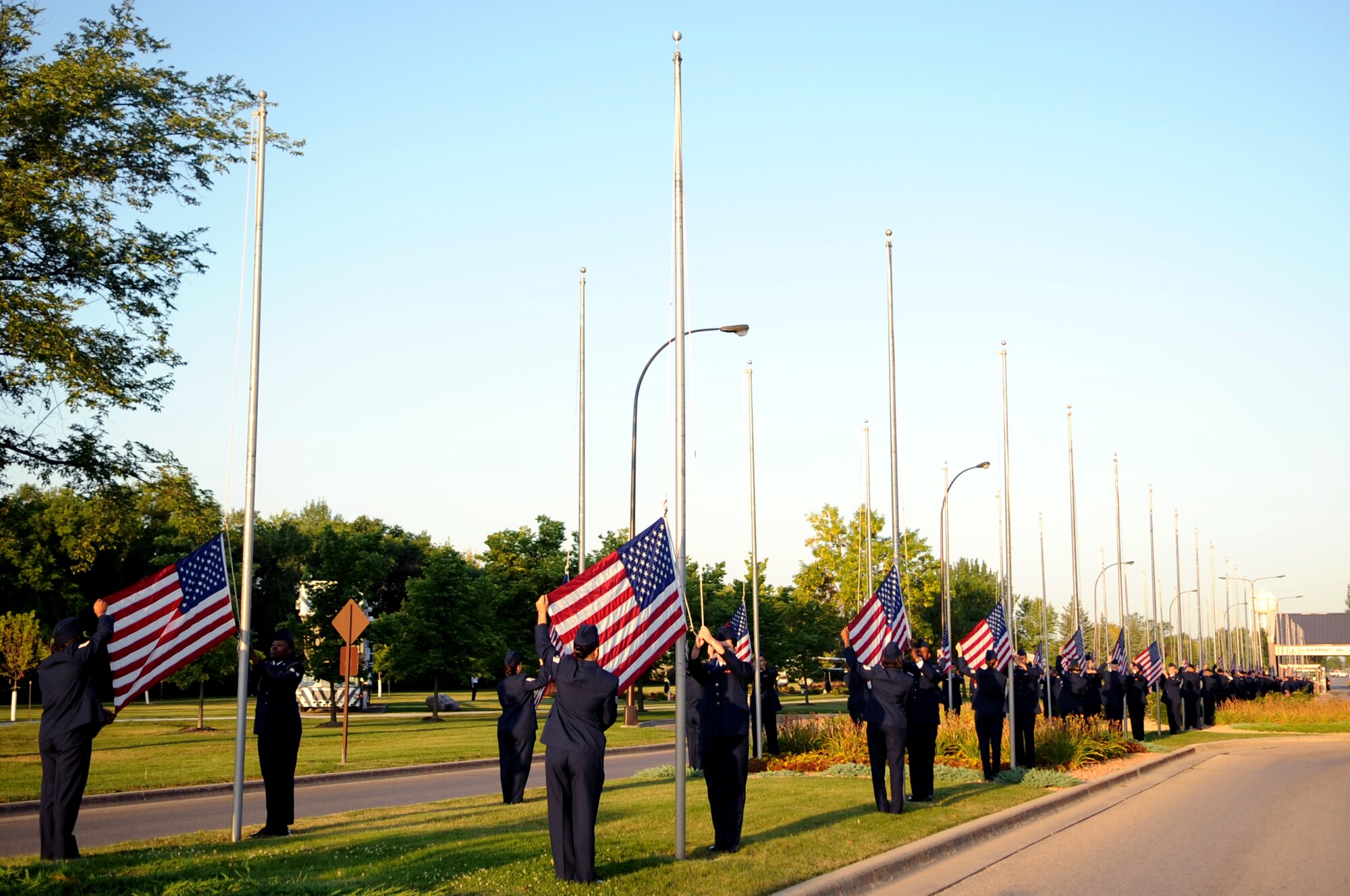 Airmen wait for the command to raise the flag at the 9/11 Remembrance Ceremony on Grand Forks Air Force Base Sept 11. The ceremony marked the 10 year anniversary of the terrorist attacks in New York, Pennsylvania and Washington D.C. (U.S Air Force photo by Senior Airman Amanda N. Stencil)