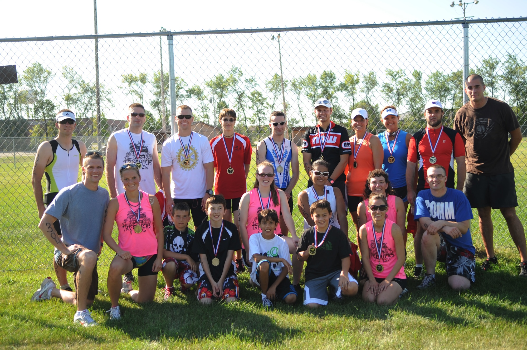 Participants from the Grand Forks Air Force Base Triathlon pose for a photo after the awards ceremony Sept 10. GFAFB sponsored a sprint triathlon which consisted of a 750m swim, 12km bike ride and a 5km run. (U.S Air Force photo by Senior Airman Amanda N. Stencil)