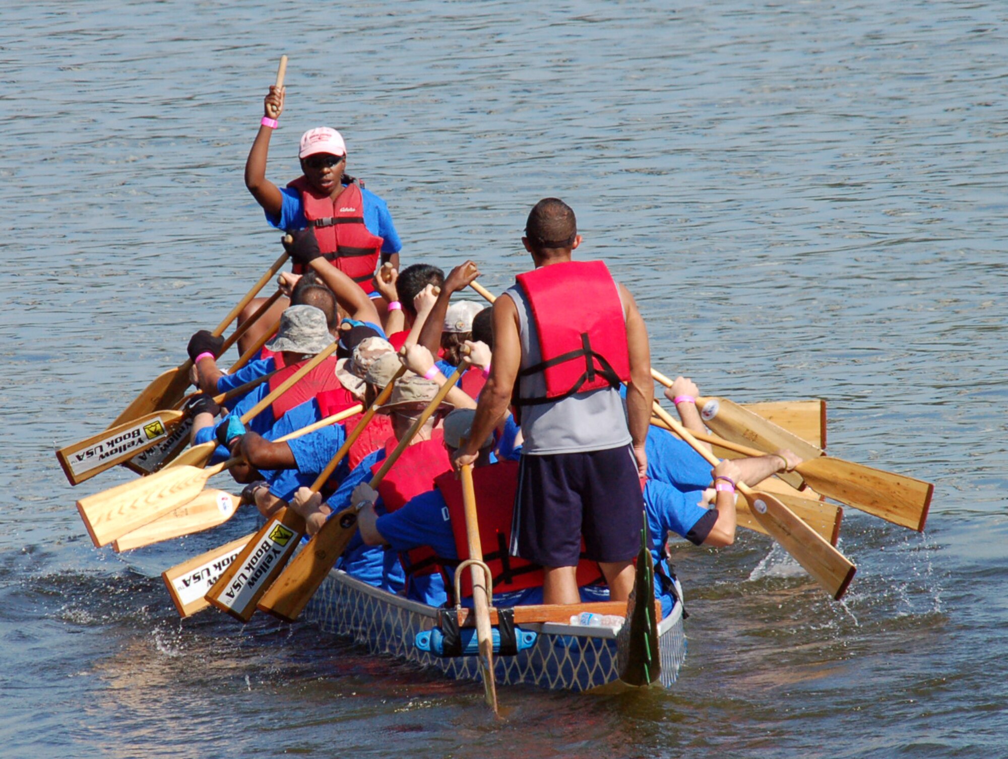 SHREVEPORT, La. - Jessica Sellers leads the “Mighty Eighth” dragon boat team out to the starting line of the dragon boat races during the third annual Red River Dragon Boat Festival Sept. 10, 2011. This year's race featured 27 teams, all vigorously paddling 41-foot-long boats to the finish line. Each team is comprised of a minimum of 20 paddlers, a captain and a drummer who beats the cadence as they paddle. (U.S. Air Force photo by Staff Sgt. Brian Stives)