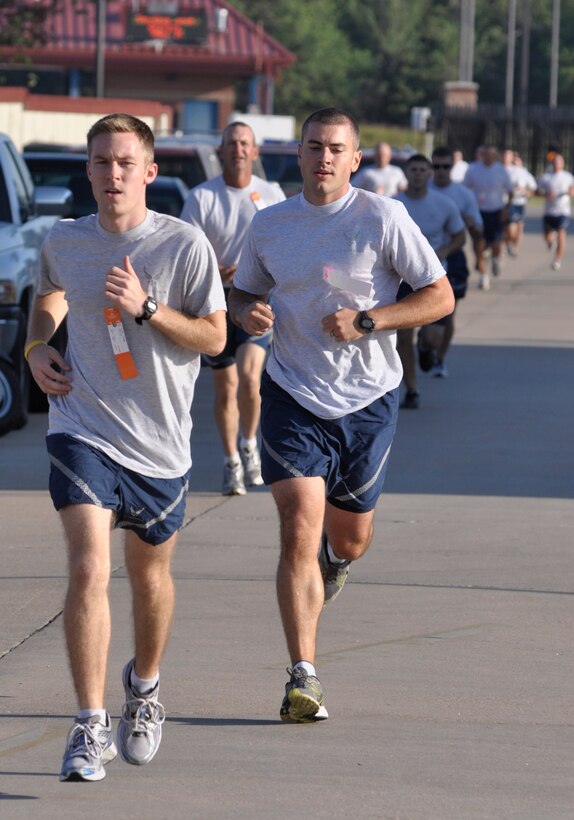 Senior Airman Cory Legg (left), 138th Communications Flight, and Master Sergeant Derrick Hildebrant (right), 138th Civil Engineering First Sergeant, set a fast pace early during the running portion of the annual Air Force Fitness Test at the 138th Fighter Wing, Oklahoma Air National Guard, Tulsa, OK.  (U.S. Air Force Photo by:  Master Sergeant Preston Chasteen)