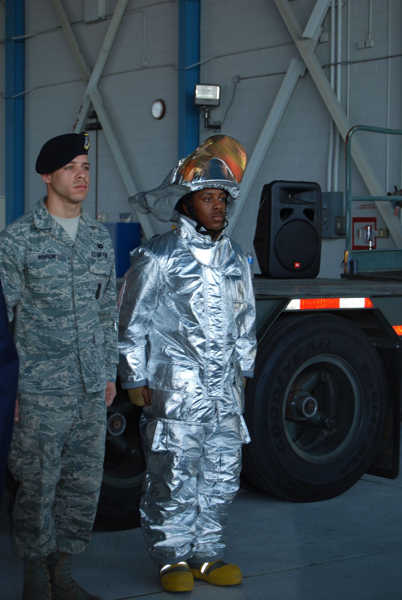 Staff Sgt. Kente Winrow, from the 433rd Security Forces Squadron, left, and Airman Andre Adams, a firefighter with the 433rd Civil Engineer Squadron, represented first responders during the Alamo Wing's ceremony observing the 10th anniversary of the attacks of 9-11. (U.S. Air Force photo/Senior Airman Viola Hernandez)