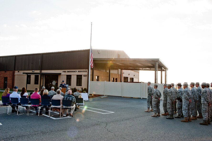 Audience members pay their respects during a moment of silence during the 9-11 memorial ceremony on Moody Air Force Base, Ga. on Sept. 11, 2011. This year marks the tenth anniversary of the attacks. The ceremony honored the thousands of people who lost their lives during the event. (U.S. Air Force photo by Staff Sgt. Joshua J. Garcia/Released)
