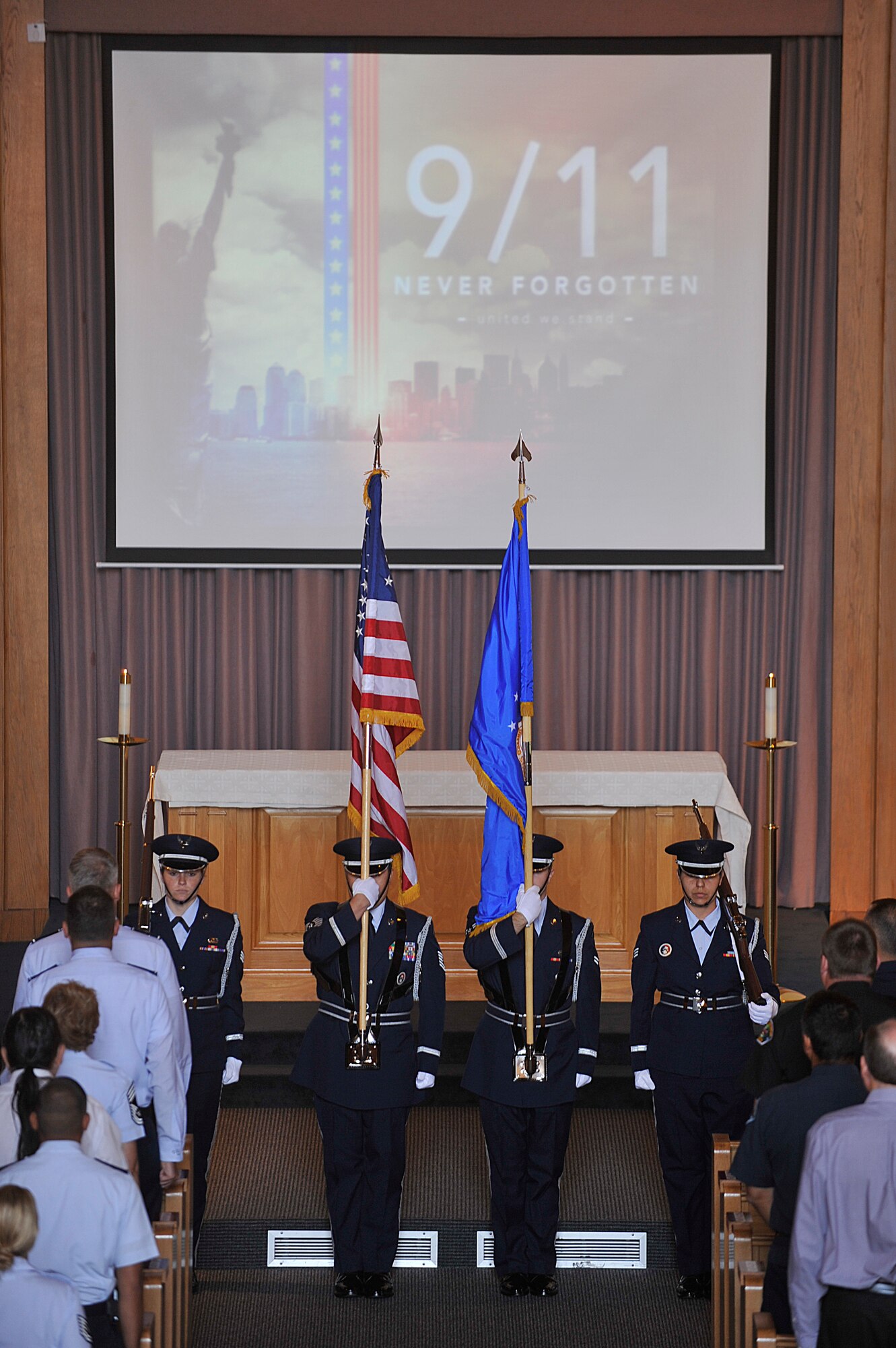 VANDENBERG AIR FORCE BASE, Calif. -- Members of the Vandenberg Honor Guard post the colors during a 9/11 Memorial ceremony at the base chapel here Monday, Sept. 11, 2011. The ceremony paid tribute to fallen heroes of the 9/11 attacks. (U.S. Air Force photo/Staff Sgt. Andrew Satran) 

 
 