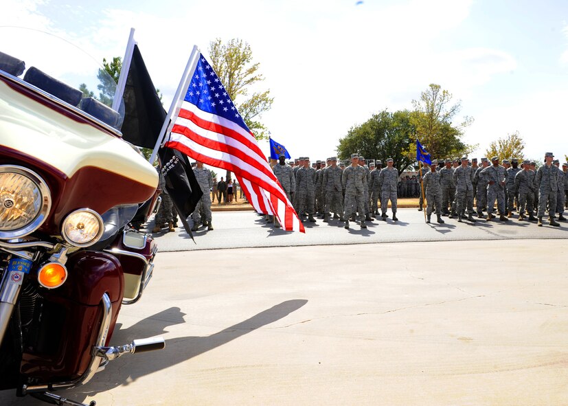 Team Dyess stands in formation Sept. 9, 2011 during a 9/11 tribute ceremony at Dyess Air Force Base, Texas. Team Dyess paid tribute to those lost during the 9/11 attacks. (U.S. Air Force photo by Airman 1st Class Jonathan Stefanko/ Released)