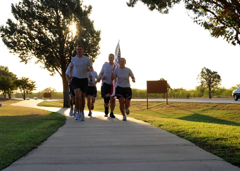 Members from Team Dyess participate in a 24-Hour Vigil Run Sept. 8, 2011 to pay tribute to those lost during the 9/11 attack. (U.S. Air Force photo by Airman 1st Class Jonathan Stefanko/ Released)