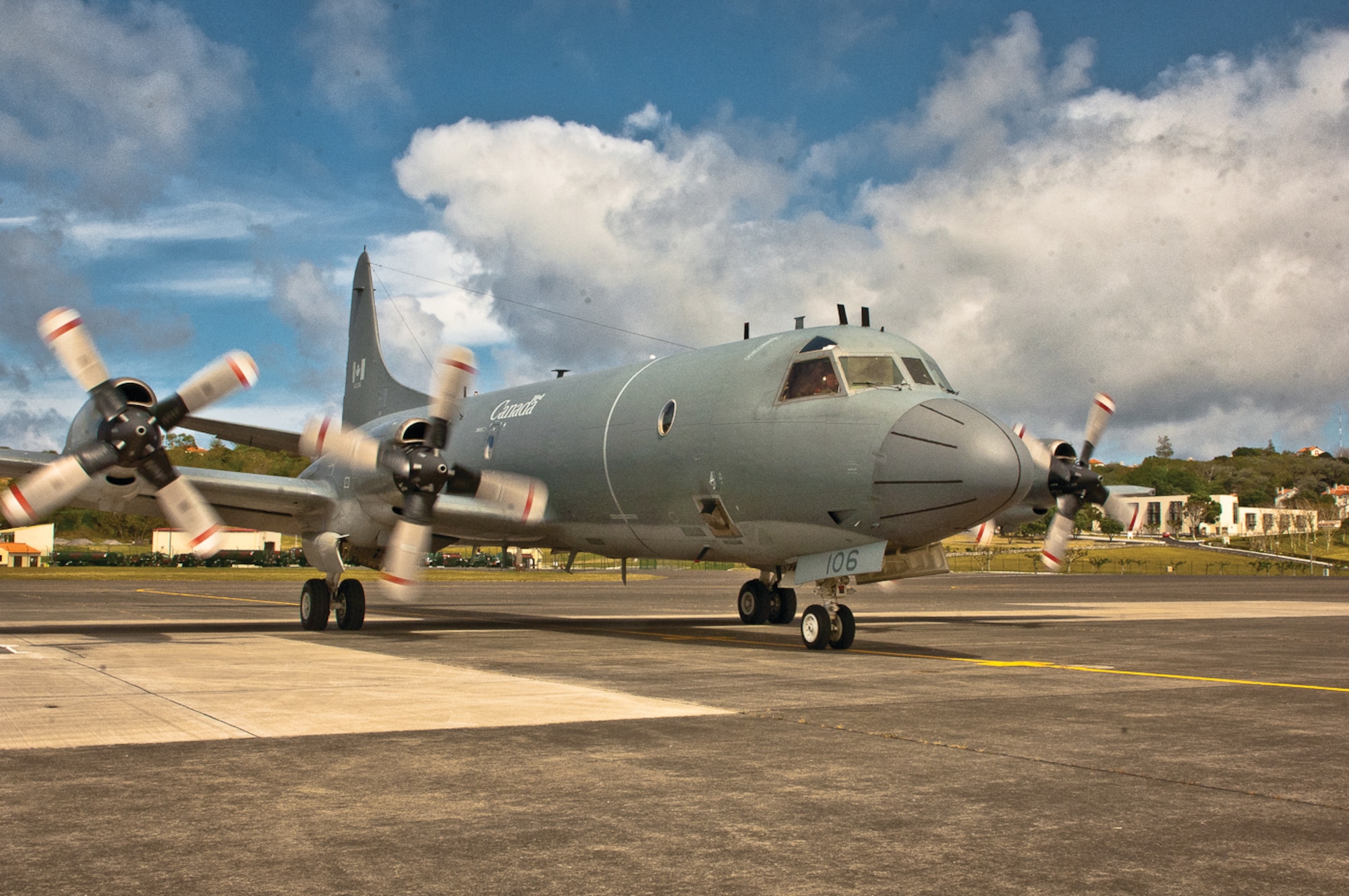 A Canadian P-3 Orion sits on the Lajes ramp after an in-flight emergency Aug. 23, 2011.  The grounded aircraft was on its way to Canada when it returned to Lajes due to oil leakage. Lajes Airmen supported the Canadian maintenance crew with aircraft ground equipment and transient alert service.  (Photo by Lucas Silva