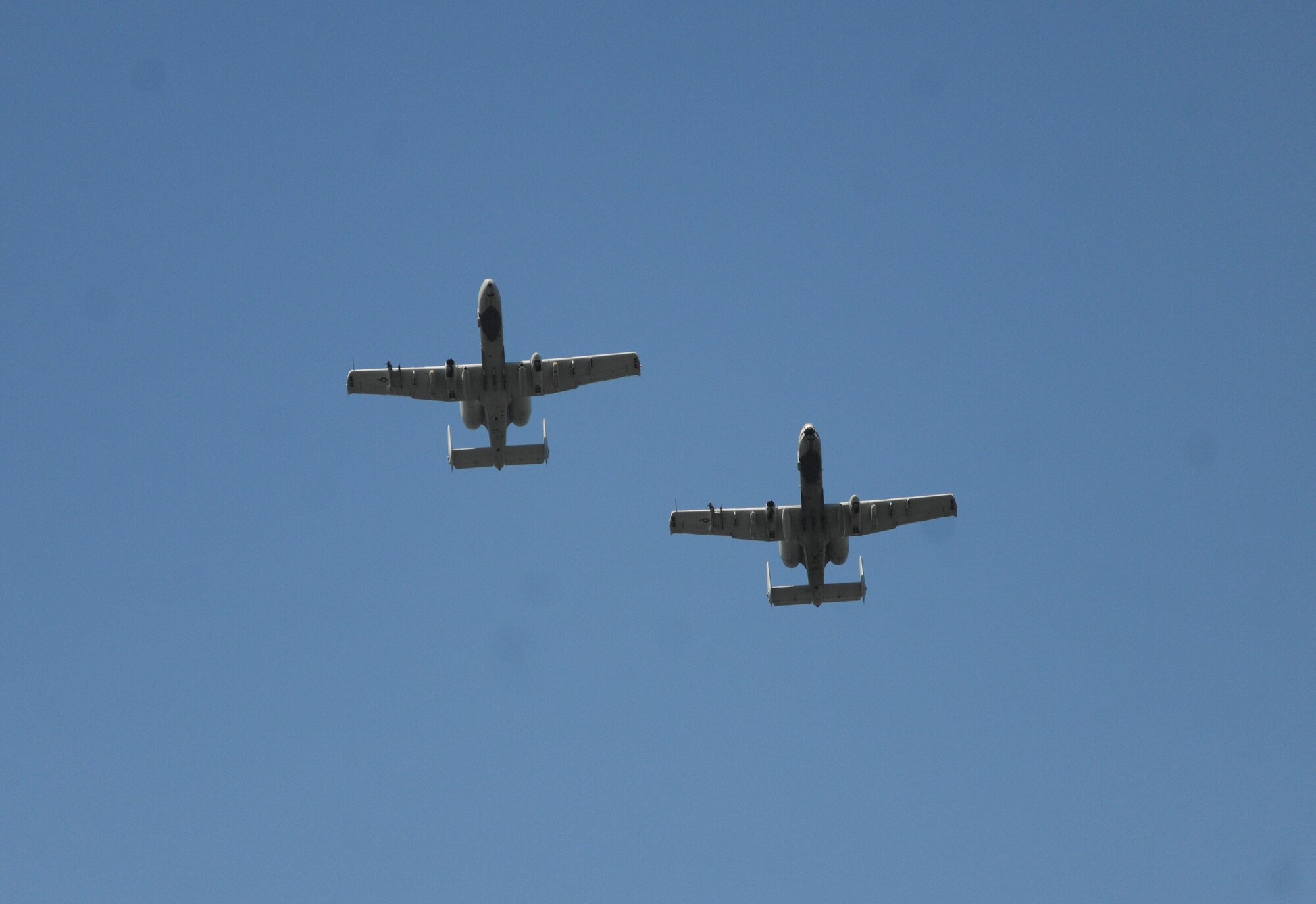 Two A-10C Thunderbolt II’s from the 76th Fighter Squadron at Moody Air Force Base, GA fly over the Valdosta courthouse Sept. 11, 2011. Airmen, and community members gathered in downtown Valdosta to remember those lost on Sept. 11, 2001.(U.S. Air Force photo by Airman 1st Class Paul Francis/Released)
