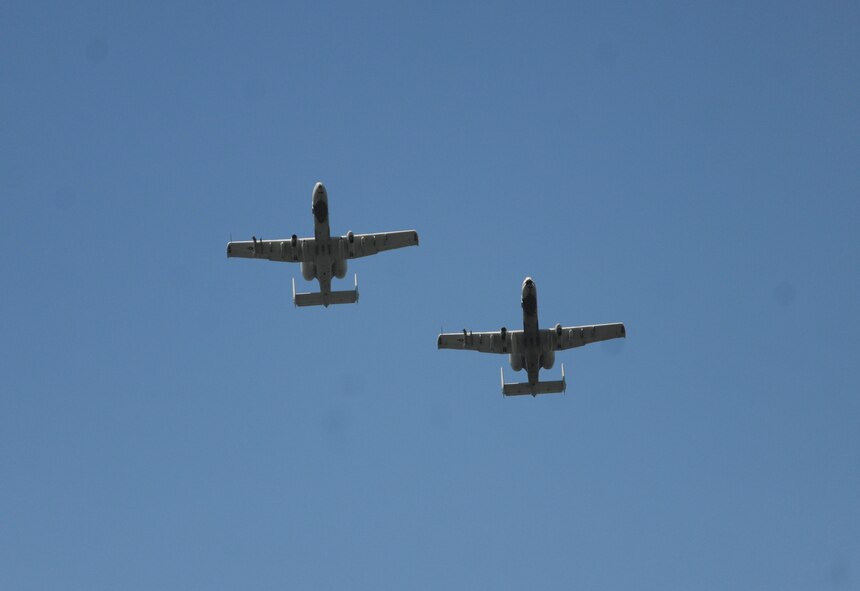Two A-10C Thunderbolt II’s from the 76th Fighter Squadron at Moody Air Force Base, GA fly over the Valdosta courthouse Sept. 11, 2011. Airmen, and community members gathered in downtown Valdosta to remember those lost on Sept. 11, 2001.(U.S. Air Force photo by Airman 1st Class Paul Francis/Released)

