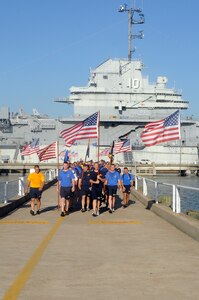 More than 200 chiefs and chief selects from Joint Base Charleston-Weapons Station participate in the 10th annual Heritage run at Patriot’s Point, Sept. 10. The heritage run made stops at five different monuments, one being the USS Yorktown (CV 10) giving the history and significance of its role during its commission. The heritage run is designed to unite chiefs and chief selects, exemplify Navy core values of Honor, Courage and Commitment and teach chiefs about our naval heritage. (U.S. Navy photo/Mass Communication Specialist 1st Class Jennifer Hudson)