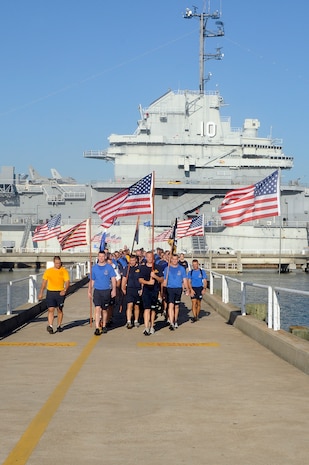 More than 200 chiefs and chief selects from Joint Base Charleston-Weapons Station participate in the 10th annual Heritage run at Patriot’s Point, Sept. 10. The heritage run made stops at five different monuments, one being the USS Yorktown (CV 10) giving the history and significance of its role during its commission. The heritage run is designed to unite chiefs and chief selects, exemplify Navy core values of Honor, Courage and Commitment and teach chiefs about our naval heritage. (U.S. Navy photo/Mass Communication Specialist 1st Class Jennifer Hudson)