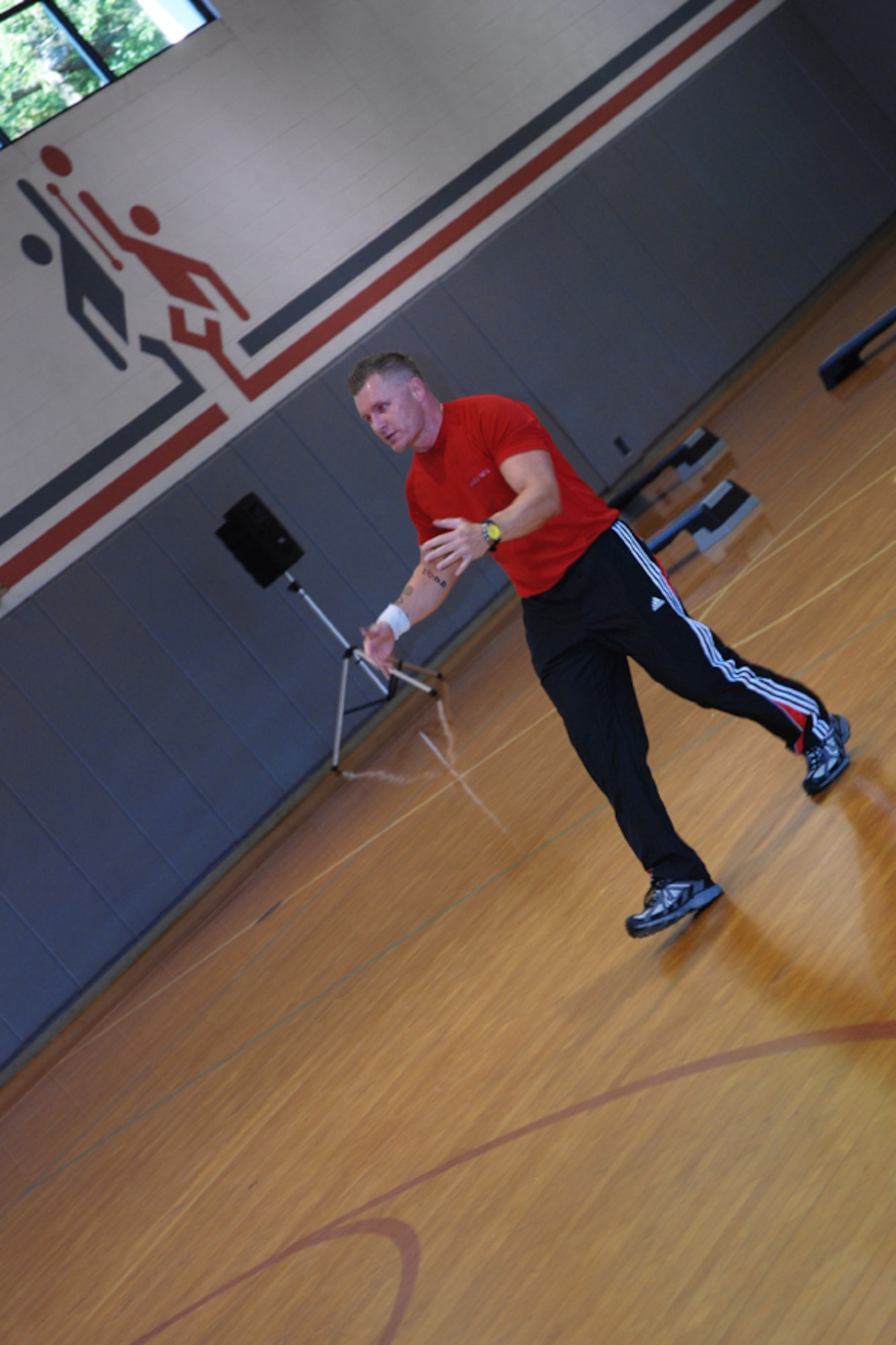 Toby Silverman of L.A. Fitness, instructs members during a cardio kickboxing class at the Dobbins gym Sept.10. The fast-passed fitness class combined elements of boxing, martial arts and aerobics, providing overall physical conditioning and toning. For more information or to offer feedback or suggestions on the Dobbins fitness program, contact Master Sgt. Lena Tamplin, wing fitness manager at (678) 655-3378. (U.S. Air Force photo/Master Sgt.  James Branch)