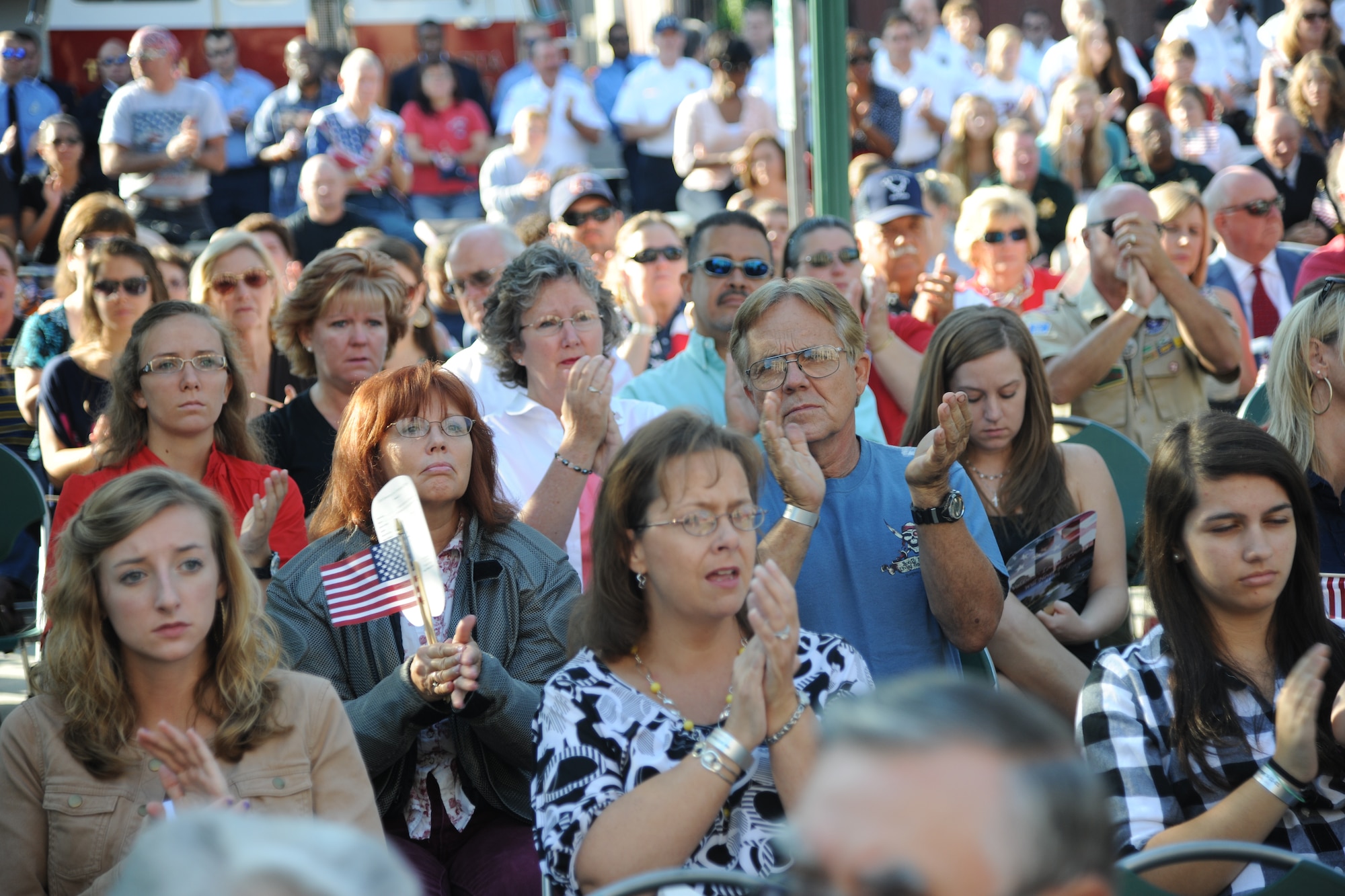 9/11 remembrance ceremony attendees applaud after a speech given by Col. Neil Robinson, 23rd Maintenance Group commander, Valdosta, Ga., Sept. 11, 2011. Robinson, was stationed at the Pentagon in 2001. (U.S. Air Force photo by Airman 1st Class Paul Francis/Released)
