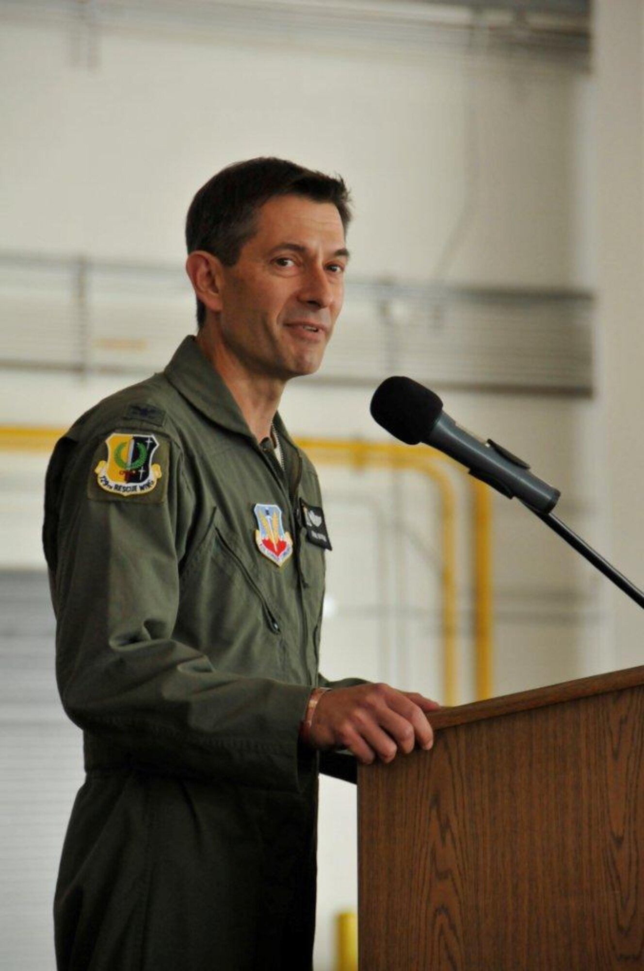 Col. Steven J. Butow, incoming 129th Rescue Wing Commander, addresses 129th Rescue Wing personnel during the wing's change of command ceremony at Moffett Federal Airfield, Calif., Sept. 10, 2011. Butow formerly served as the wing's vice commander. (Air National Guard photo by Staff Sgt. Kim Ramirez)