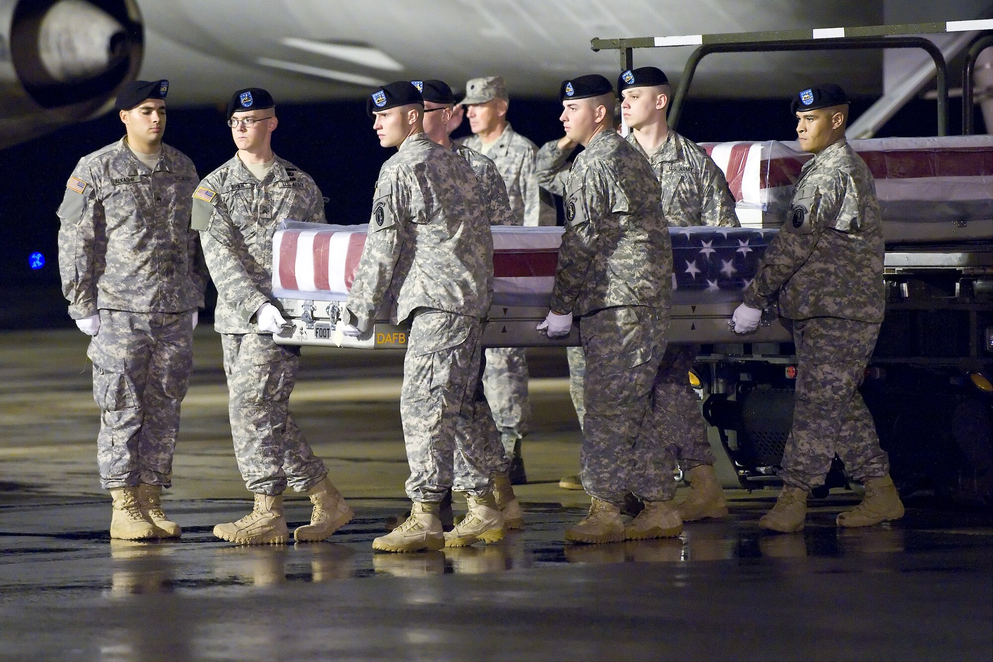 A U.S. Army carry team transfers the remains of Army Pfc. Brett E. Wood, of Spencer, Ind., at Dover Air Force Base, Del., Sep. 12, 2011. Wood was assigned to the 1st Battalion, 5th Infantry Regiment, 1st Stryker Brigade Combat Team, 25th Infantry Division, Fort Wainwright, Alaska.  (U.S. Air Force photo/Roland Balik)
